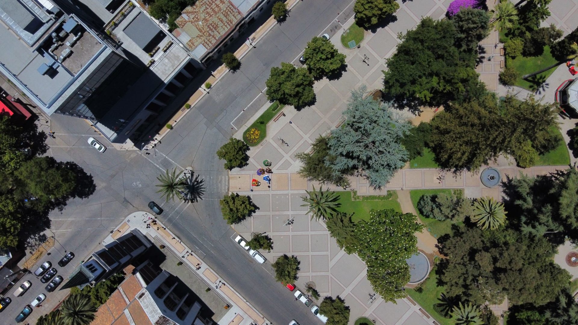 Talca's historic adobe buildings on a quiet colonial street with the Andes visible at the far end