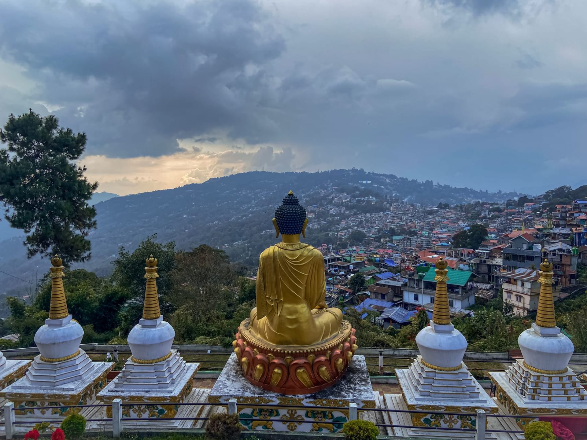 The Teesta River valley seen from a hilltop above Kalimpong on a clear afternoon, mist filling the lower gorge