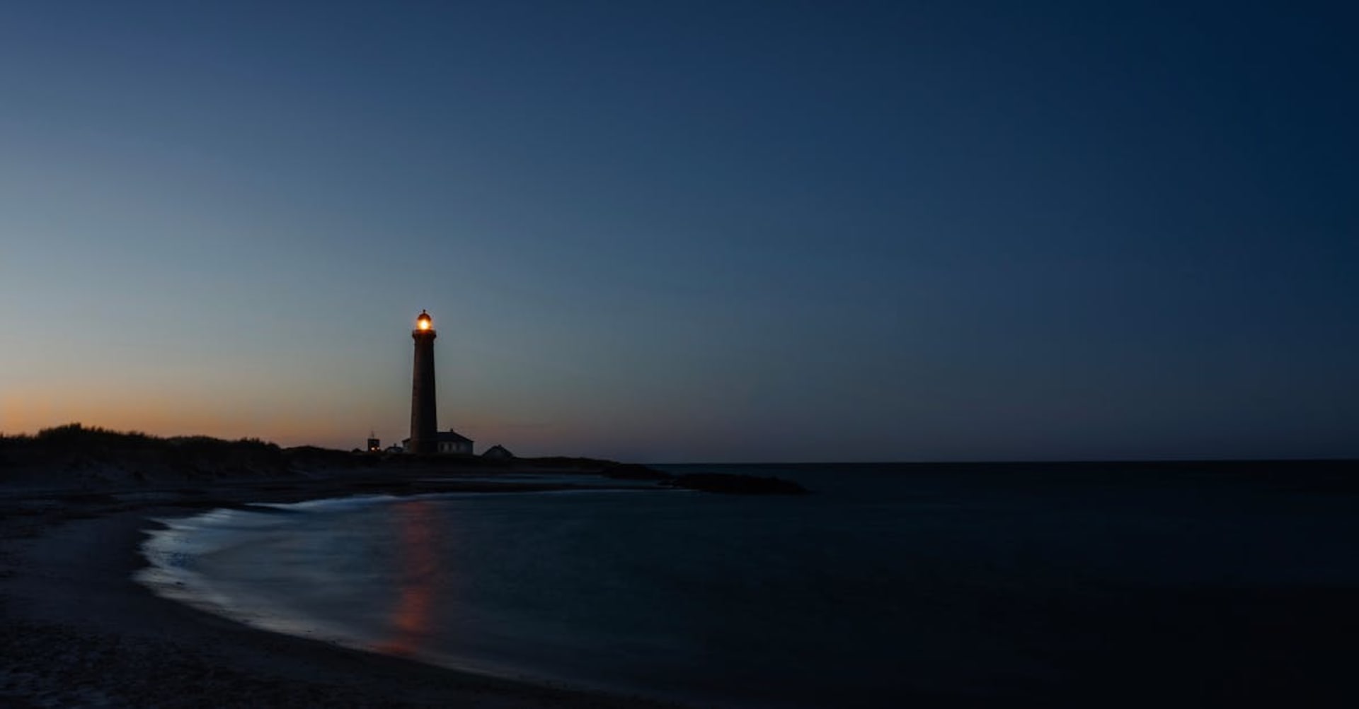 The tip of Grenen sandbar where the North Sea meets the Skagerrak under wide skies