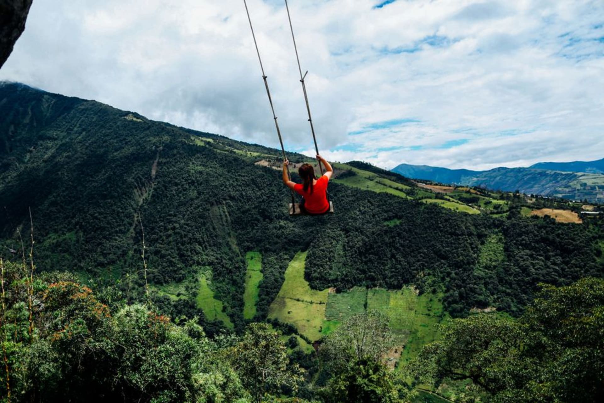 The historic Nariz del Diablo train winding down a steep switchback mountainside near Alausi, Ecuador