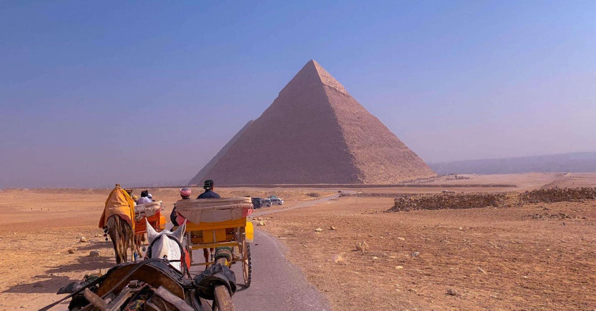Colorful beachfront cafes along Dahab's waterfront with mountains in the background