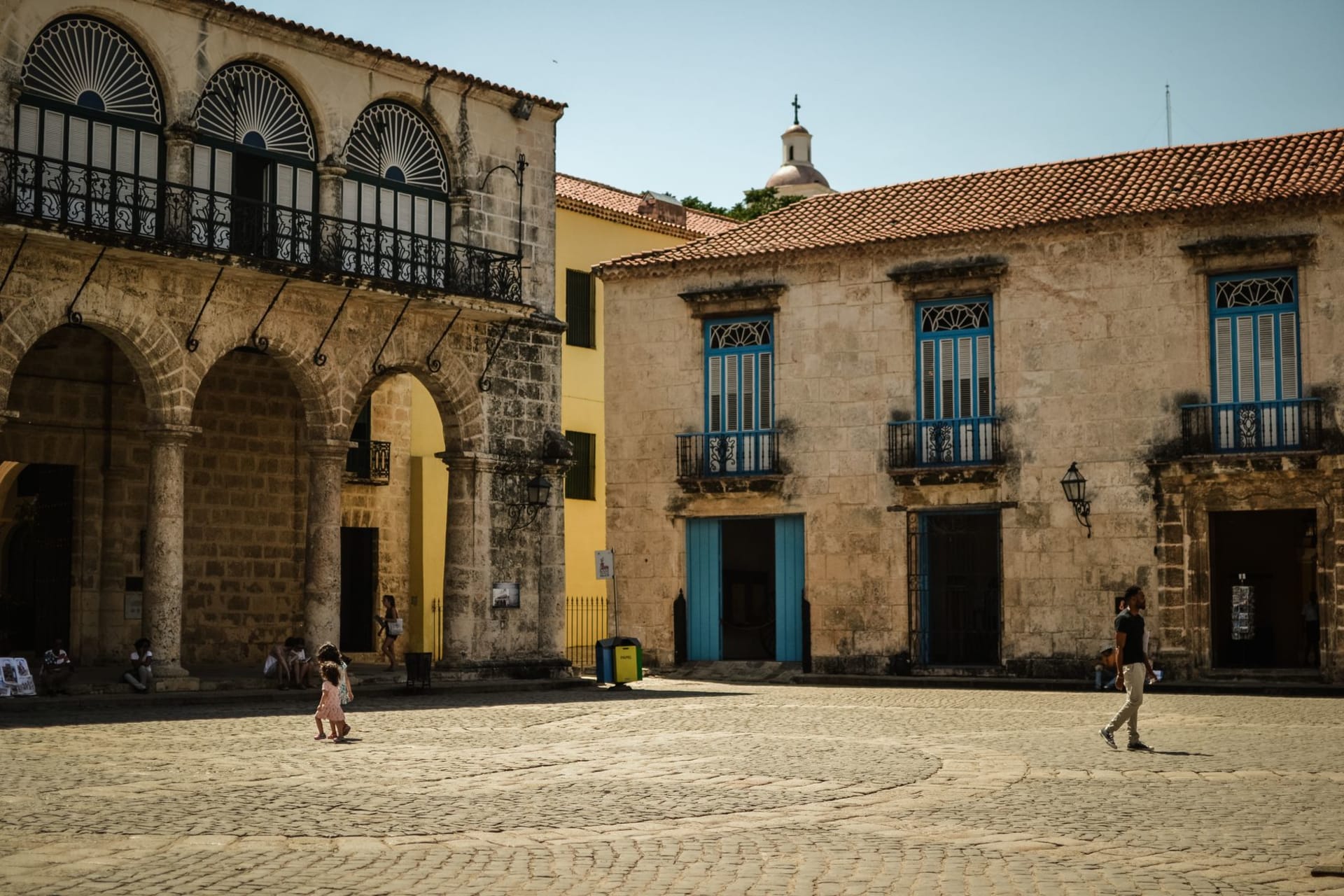 Ottoman-era coral stone buildings with arched windows along the Massawa waterfront at early morning