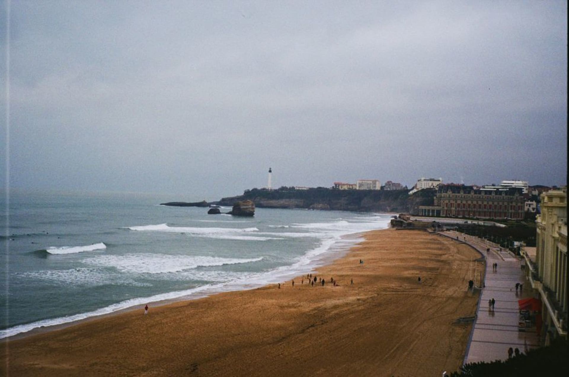 The Grande Plage of Biarritz with Atlantic waves rolling in beneath the Belle Époque Hôtel du Palais