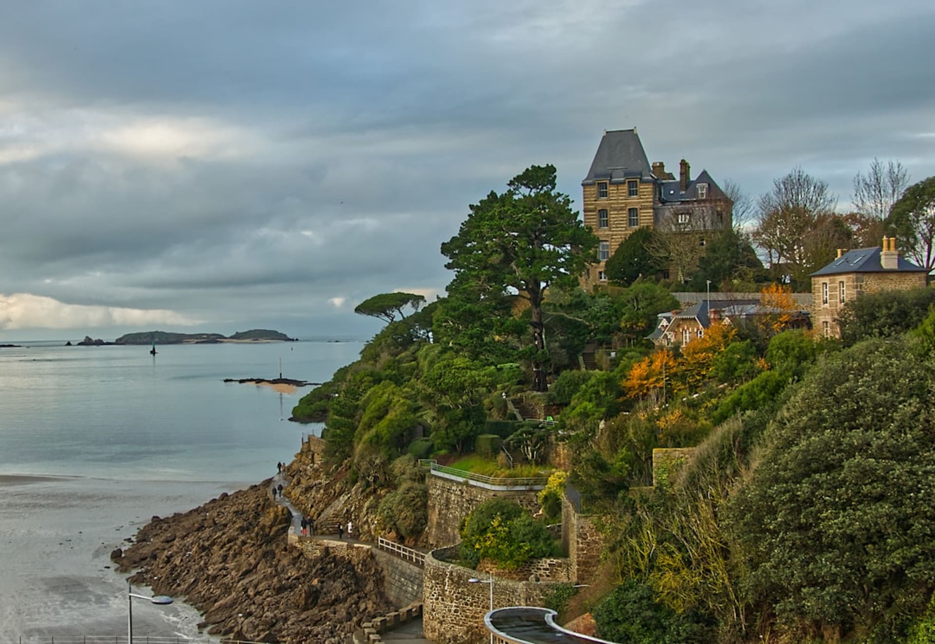 The red porphyry islets of L'Île-Rousse glowing pink at sunset just offshore from the town's promenade