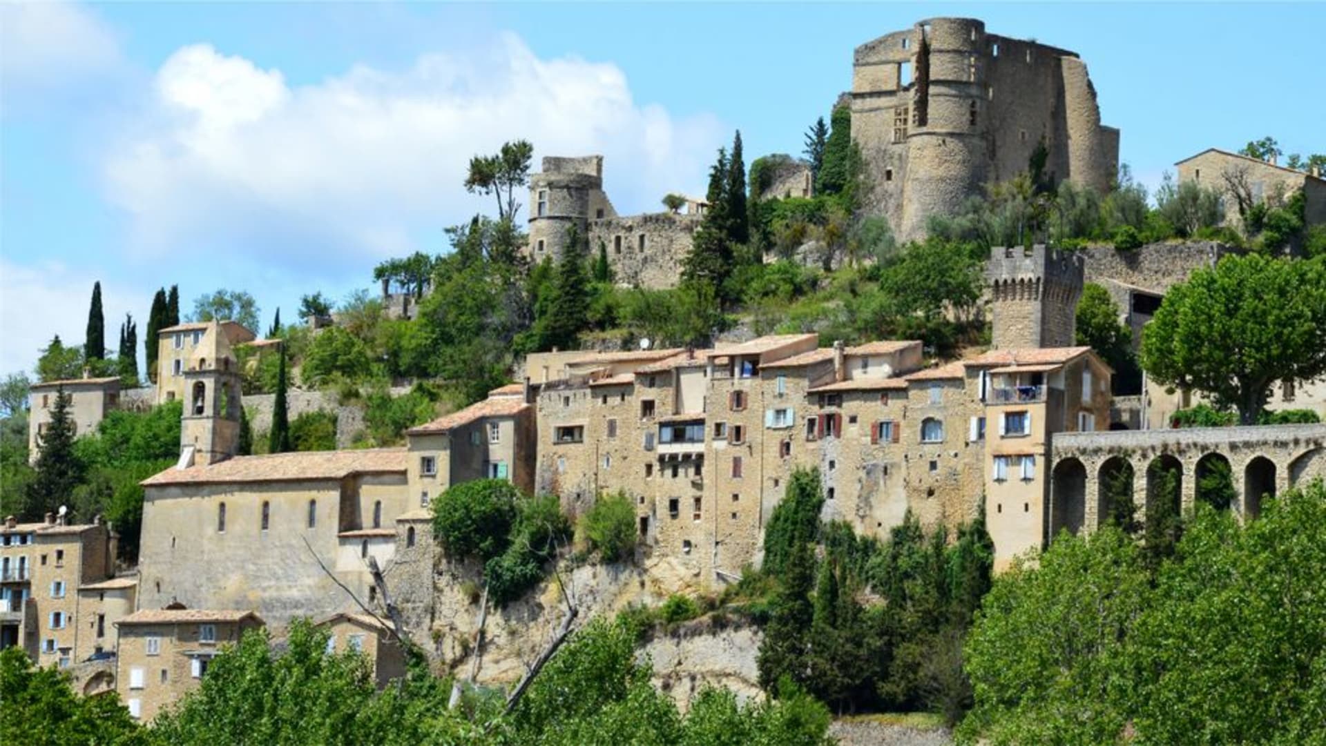 The ruined hilltop citadel of Les Baux-de-Provence fused into the jagged white limestone of the Alpilles