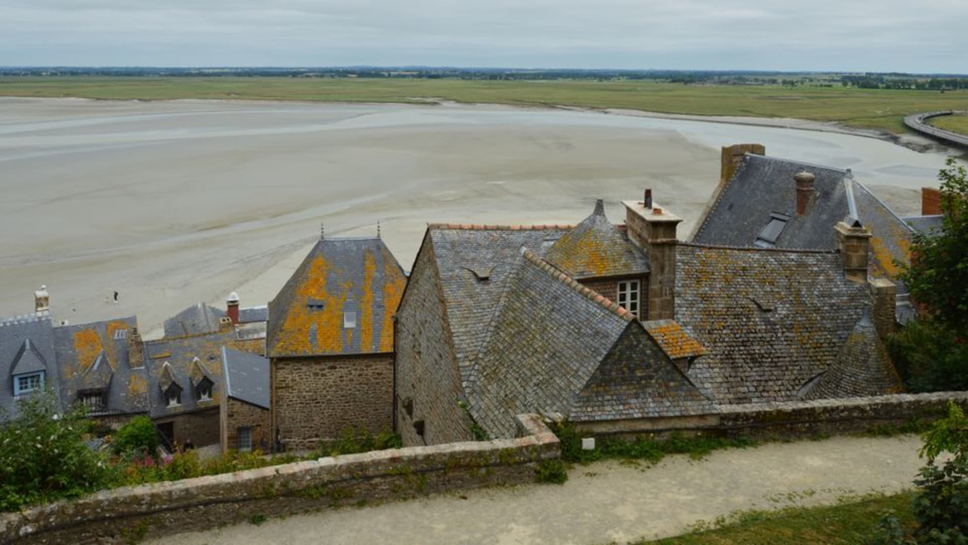 The turreted Château de Saint-Point overlooking the still waters of Lac de Saint-Point in the Jura