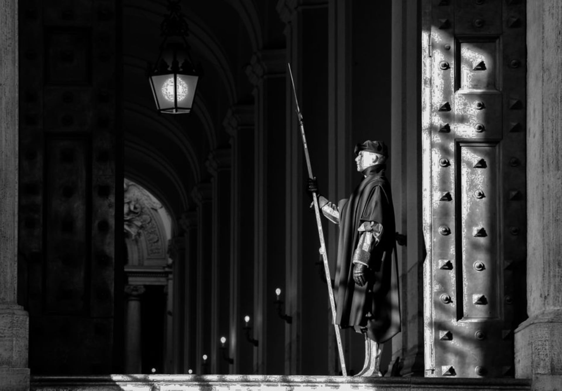 Turckheim's night watchman in traditional costume carrying a lantern and halberd through the old town at dusk