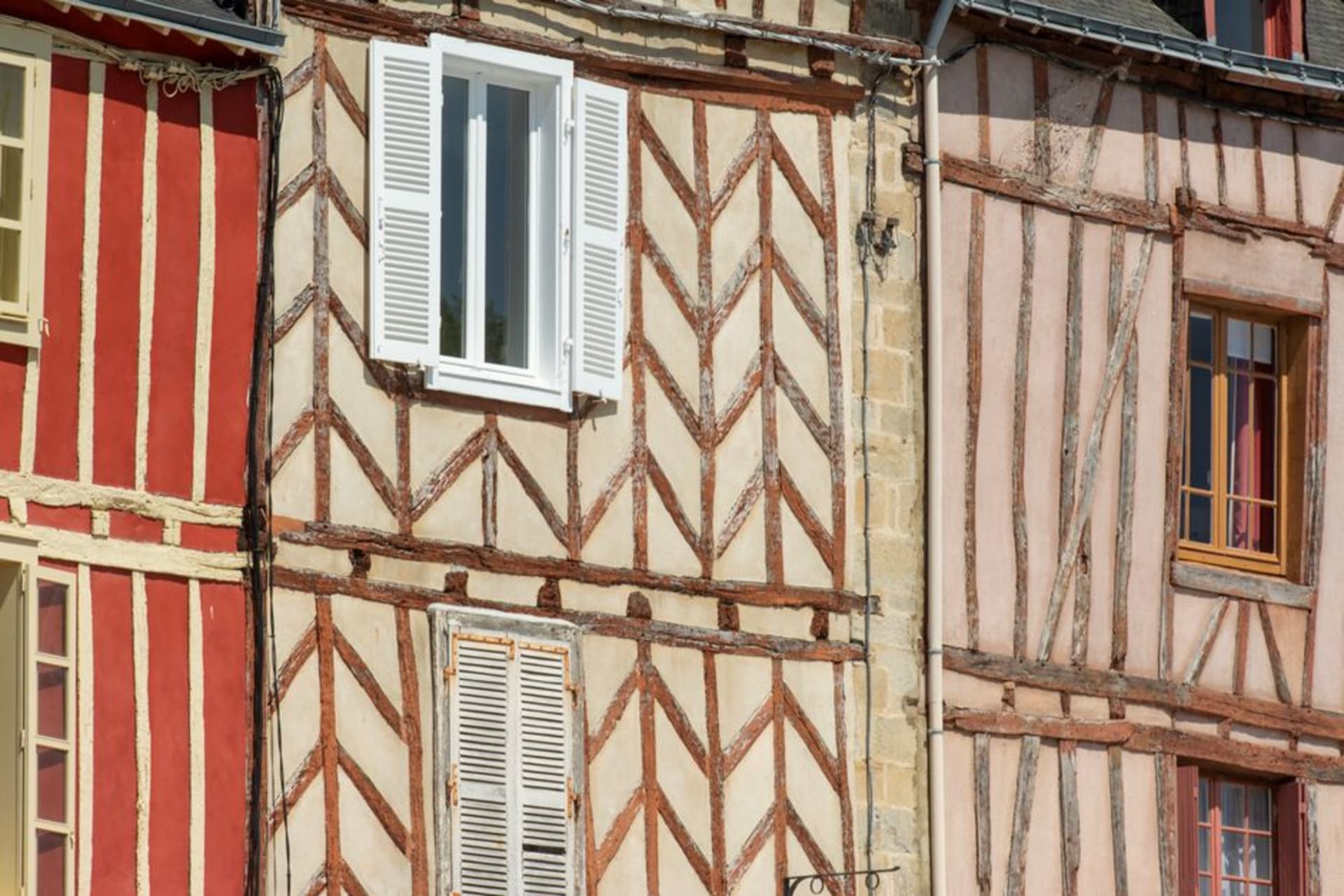 Half-timbered medieval houses along the ramparts of Vannes with stone washhouses and a moat below