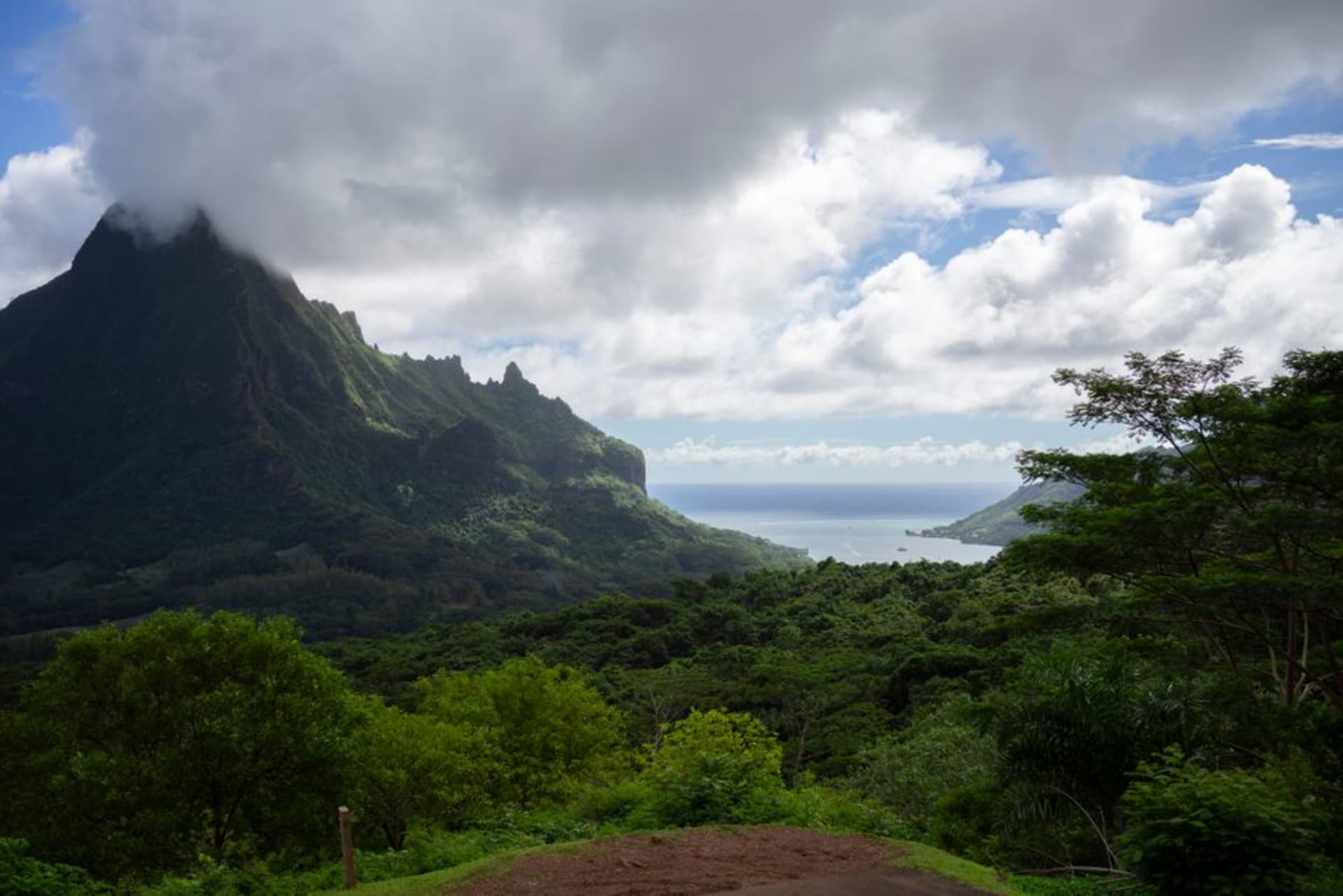 Small forested volcanic island of Maiao surrounded by a shallow closed lagoon with no boat channel to open ocean