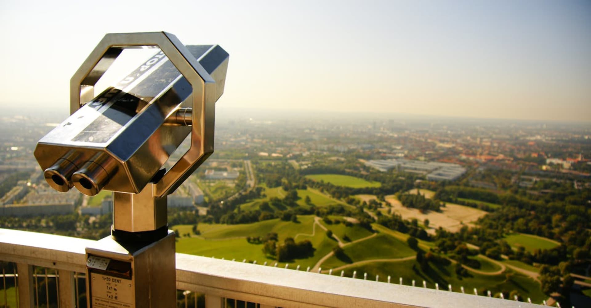 The twin domes of Munich's Frauenkirche rising above the city with the Alps in the distance