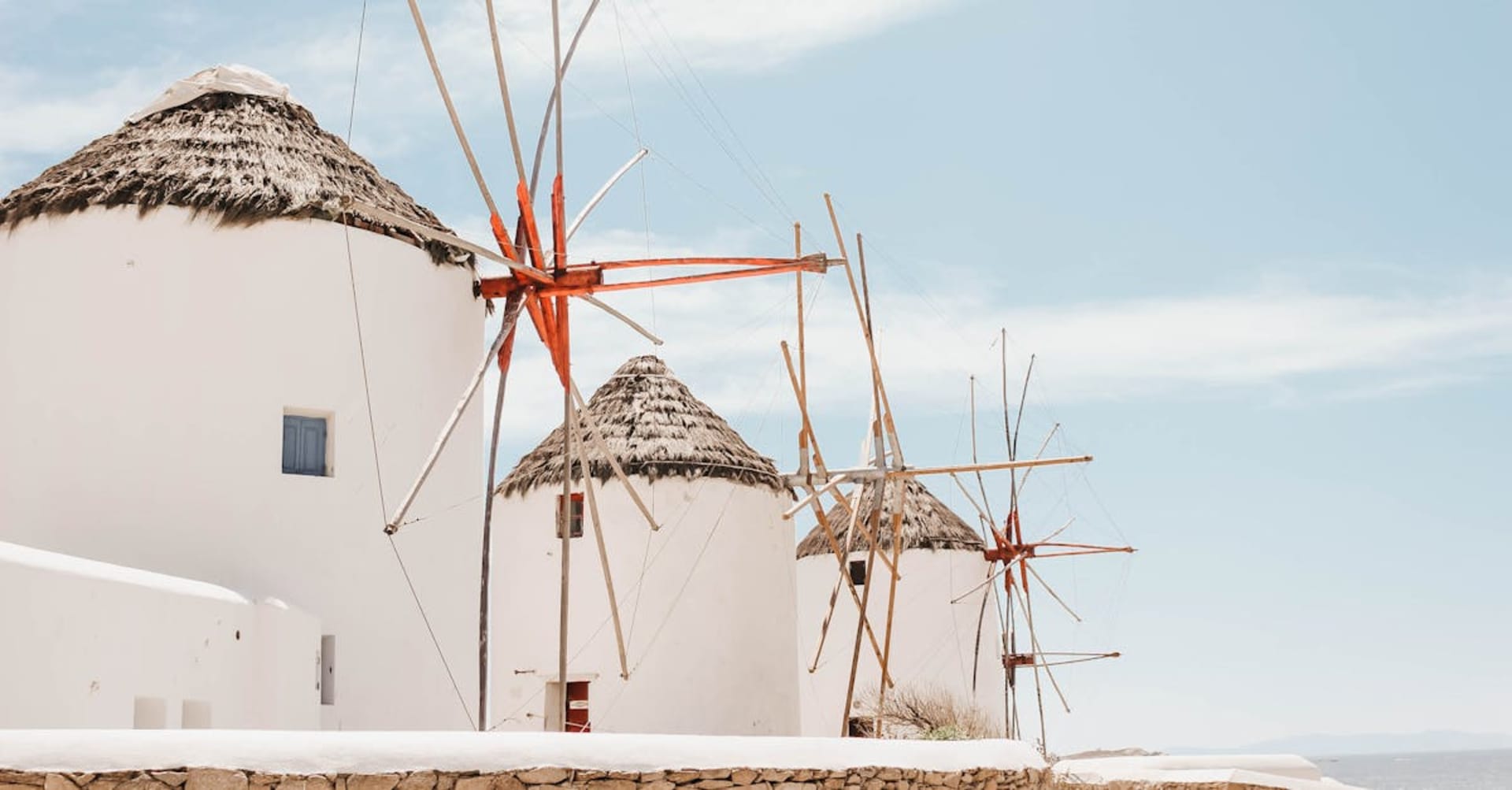 Iconic windmills above the whitewashed Little Venice waterfront on Mykonos