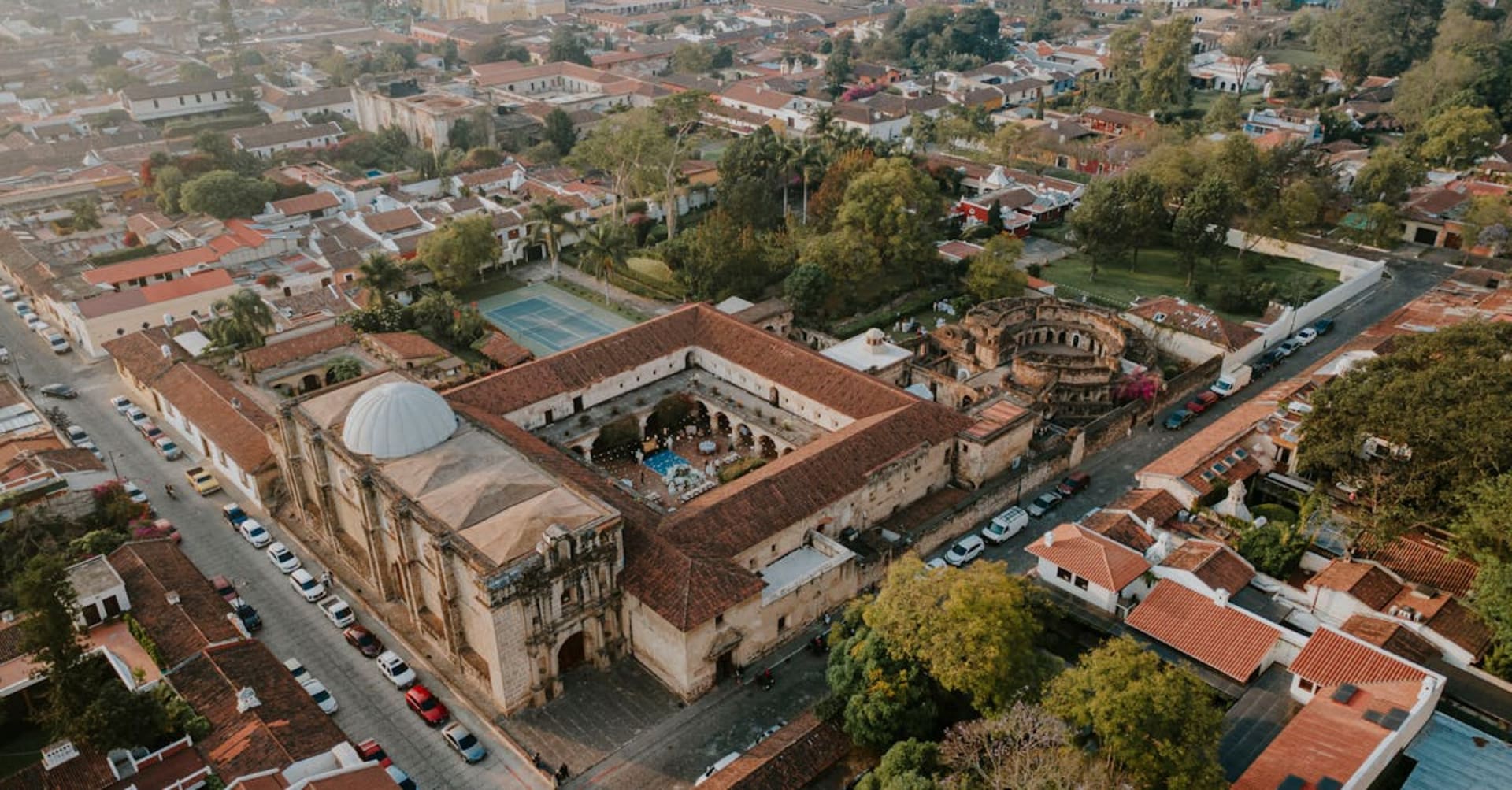 Cobblestone street in Antigua with the Santa Catalina arch and Agua volcano