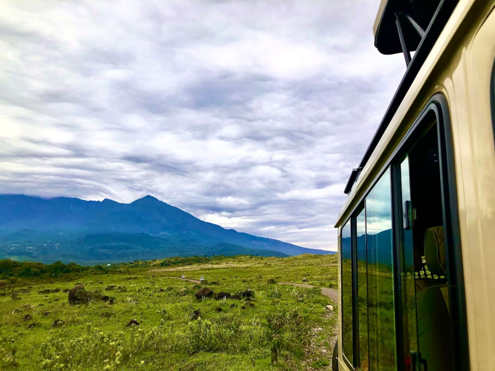 Cable car ascending above Lago de Amatitlán with Volcán de Pacaya in the distance