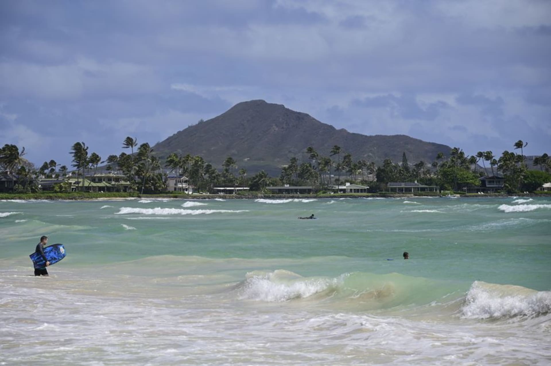 Turquoise water and white sand at Kailua Beach with the Mokulua Islands offshore