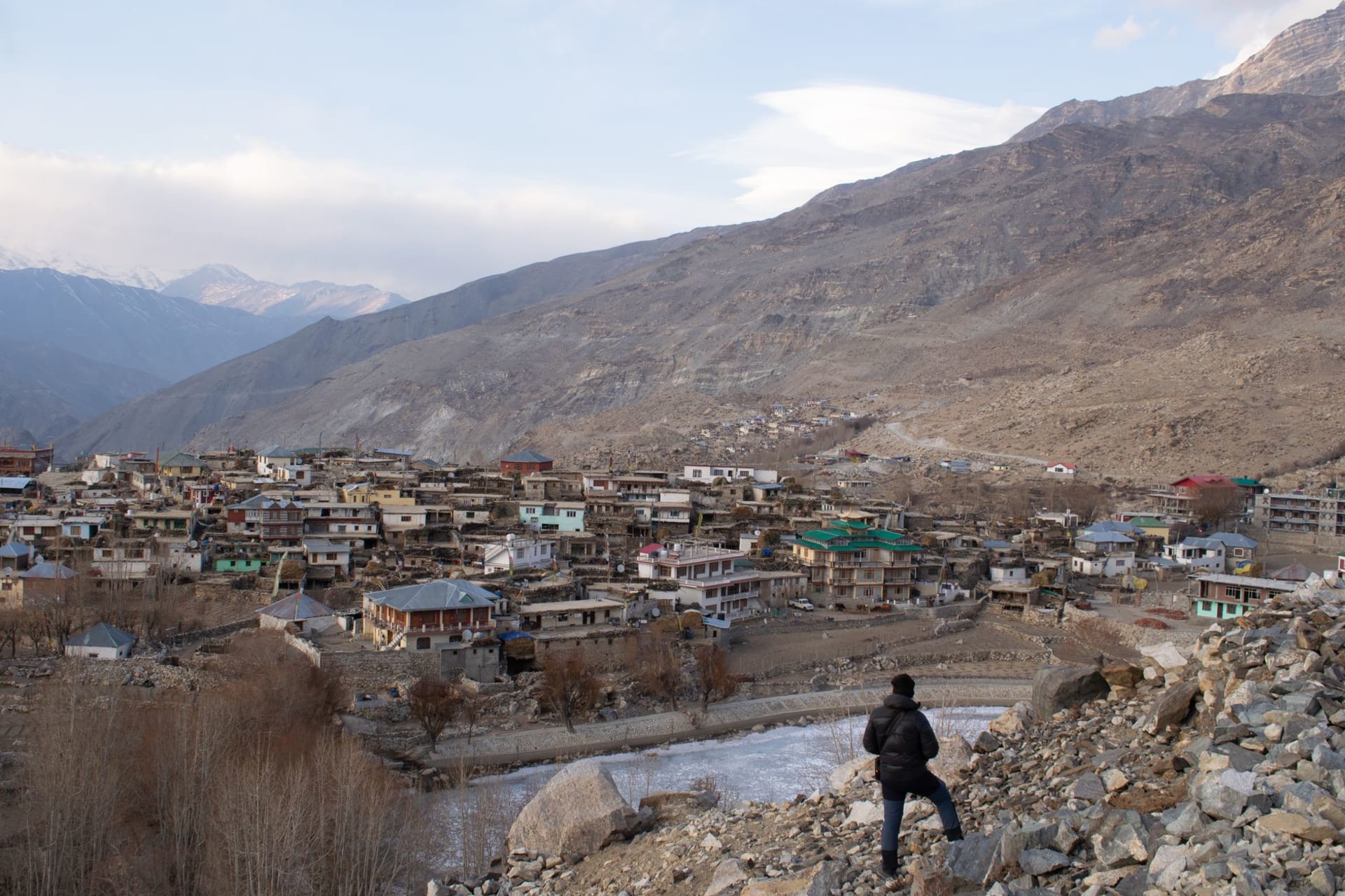 The Sutlej River gorge in Kinnaur with terraced apple orchards climbing the slopes and jagged snow peaks rising above the valley walls