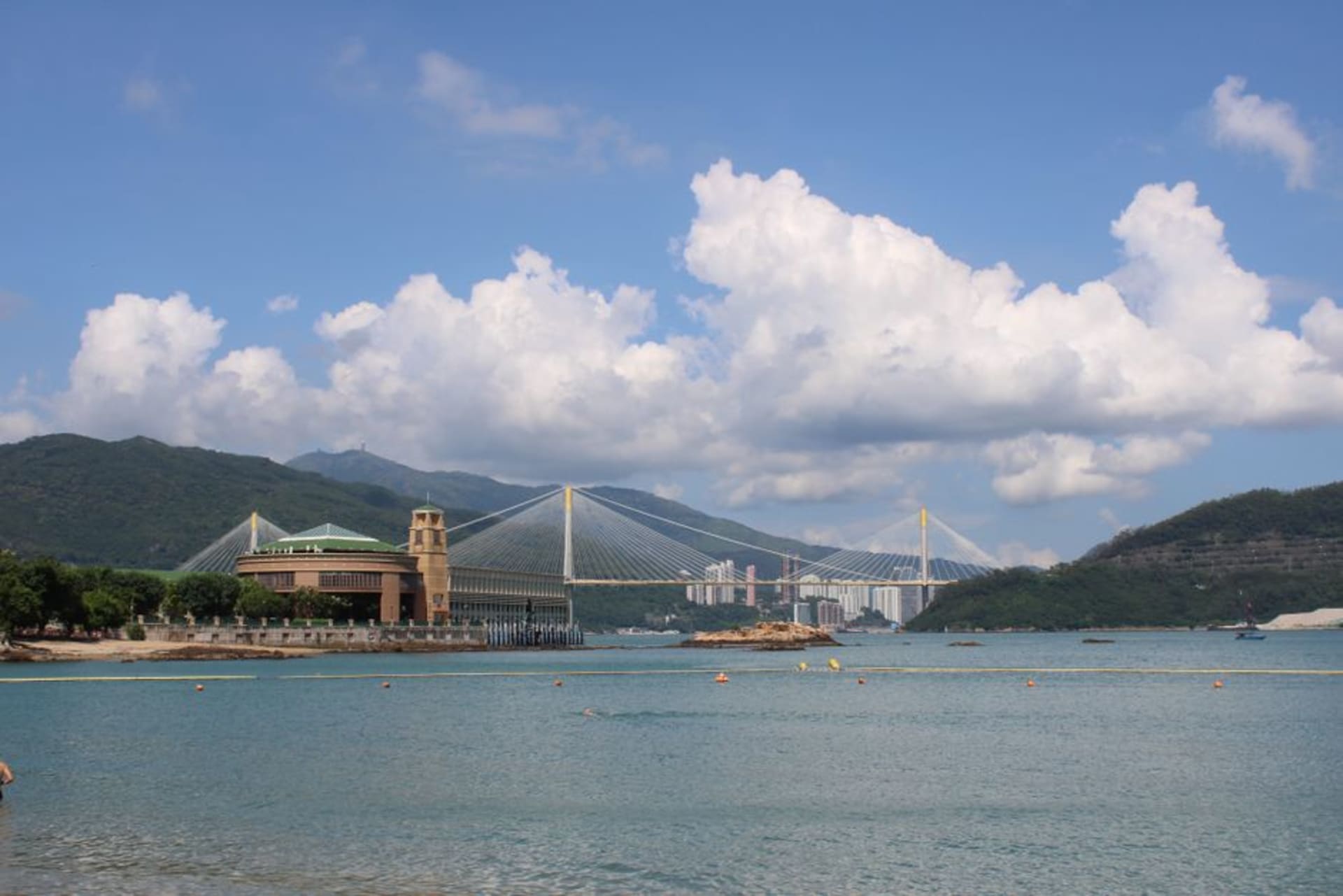 Fishing boats moored at Shau Kei Wan typhoon shelter with seafood stalls along the adjacent promenade
