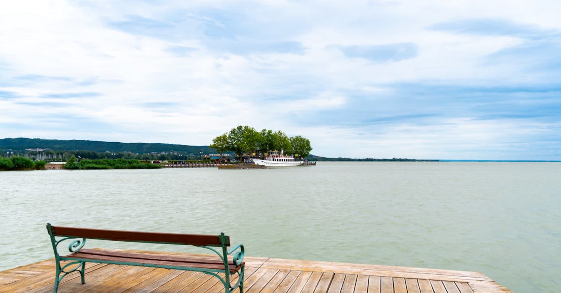 Turquoise waters of Lake Balaton with the Tihany Peninsula and its abbey church in the distance