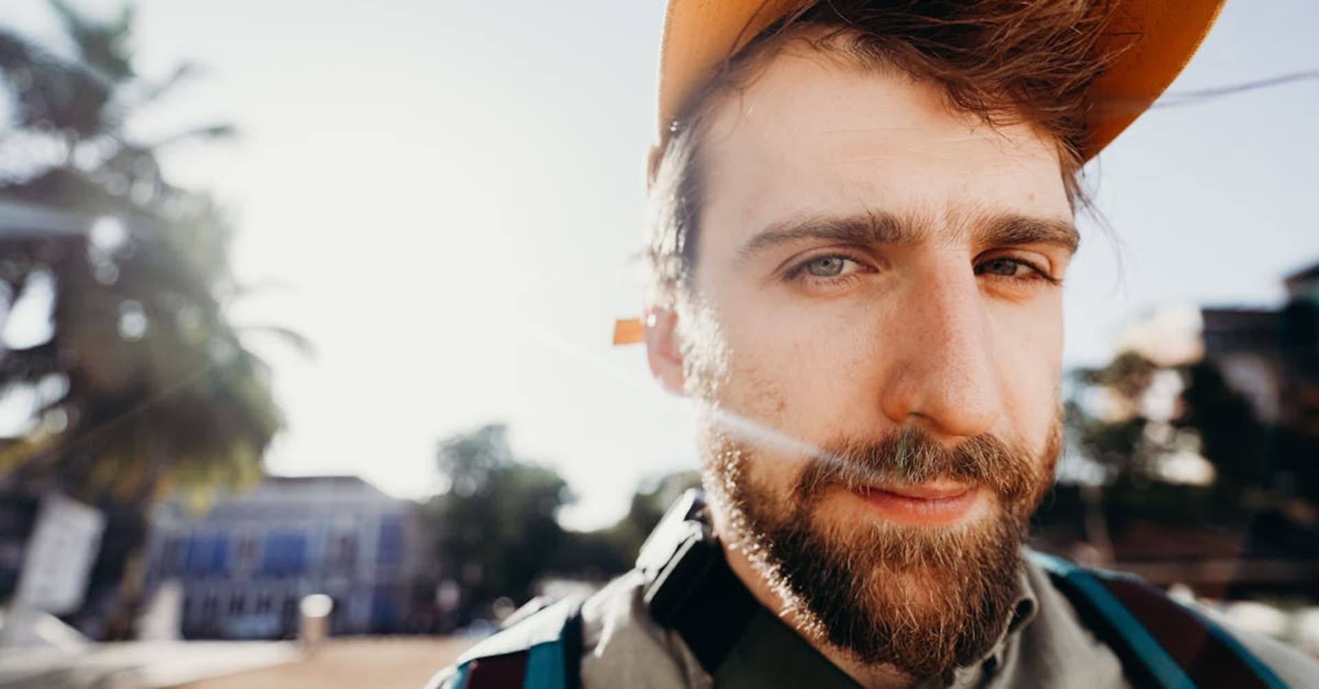 Colorful Portuguese-era buildings lining a beach road in Goa at golden hour