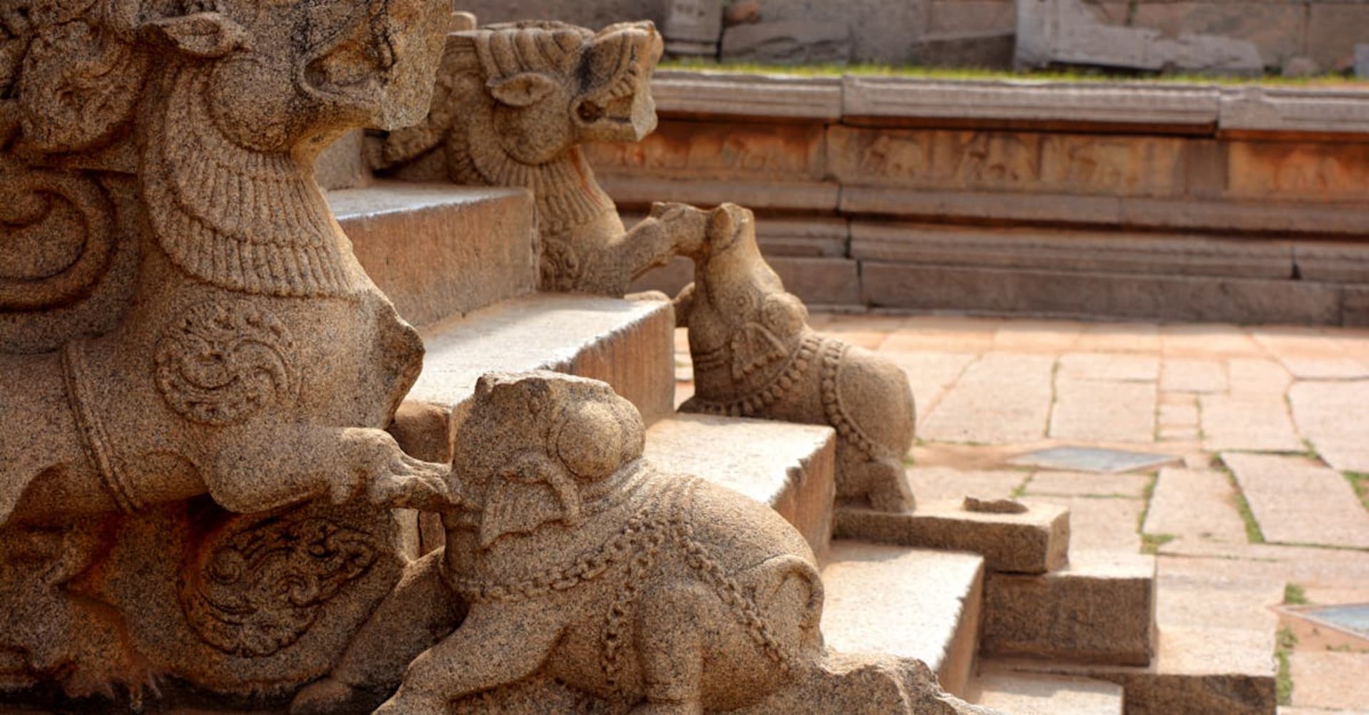 Ancient stone chariot temple among giant boulders at Hampi ruins