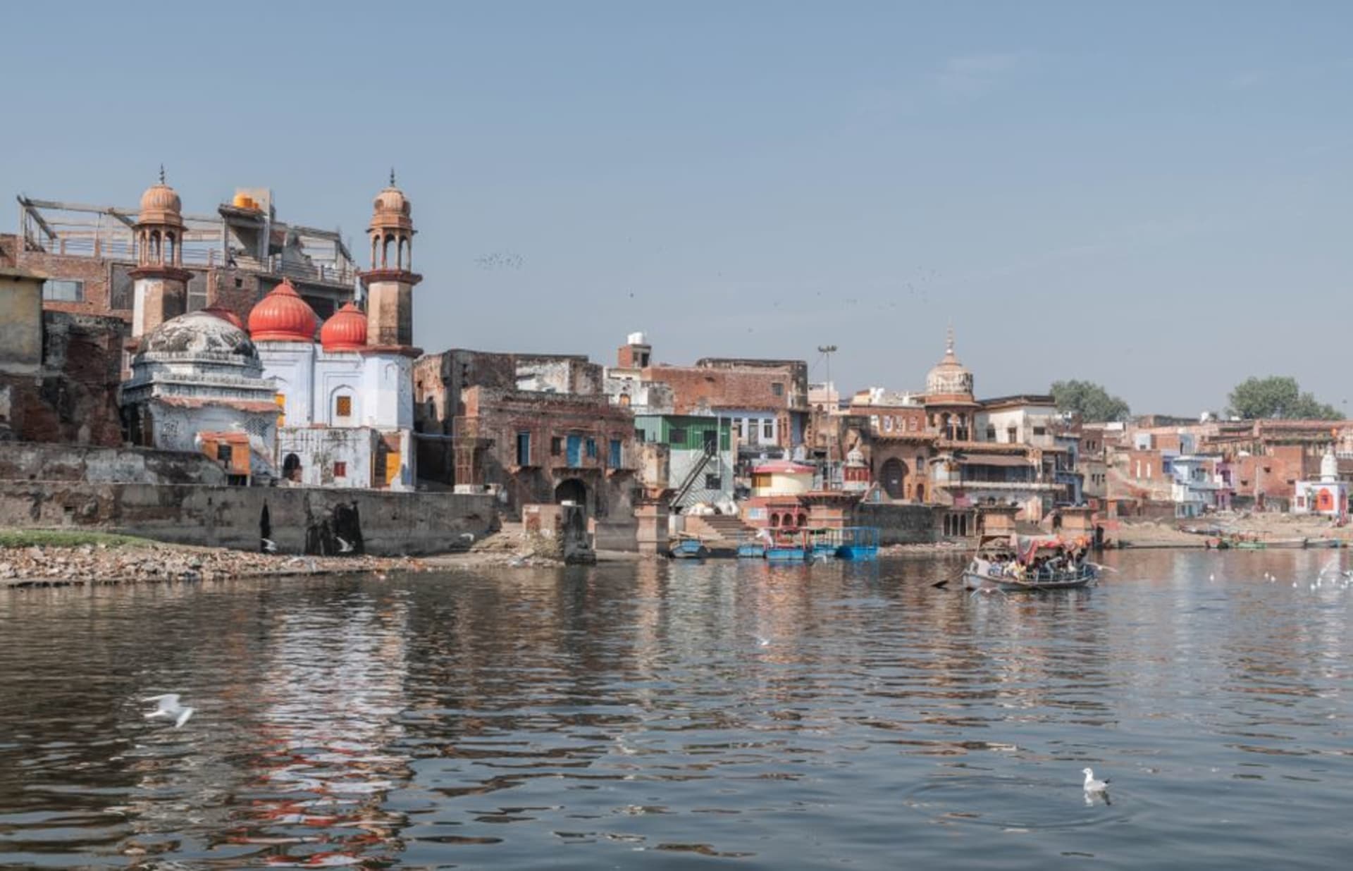 Temple spires and rooftops of Mathura beside the Yamuna river