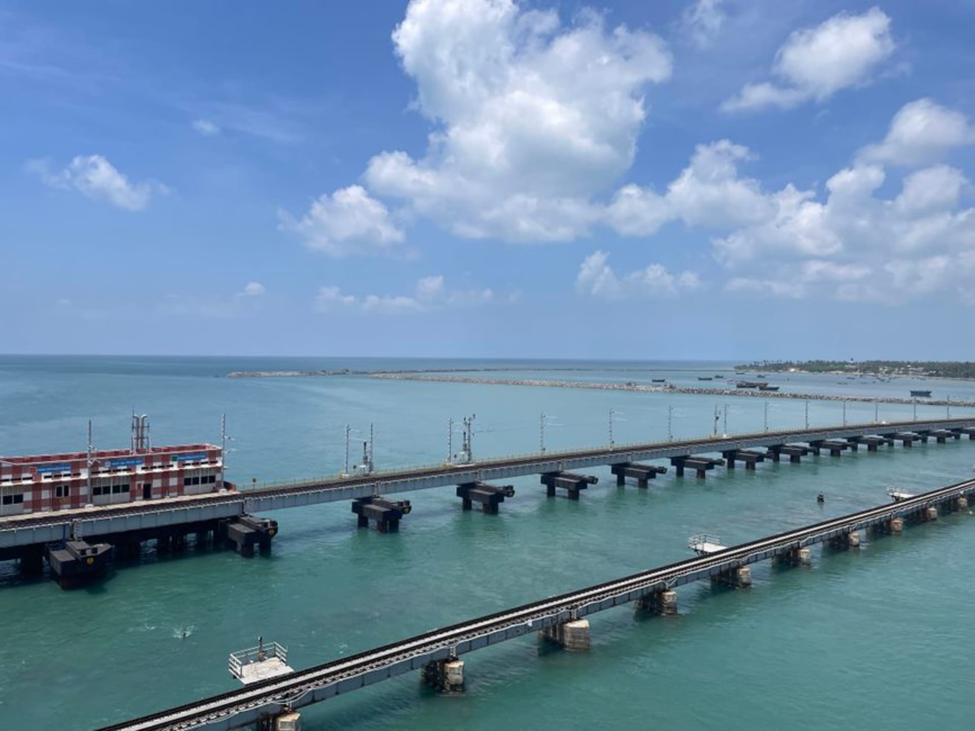 The Pamban Bridge stretching low across the turquoise strait toward Rameswaram island