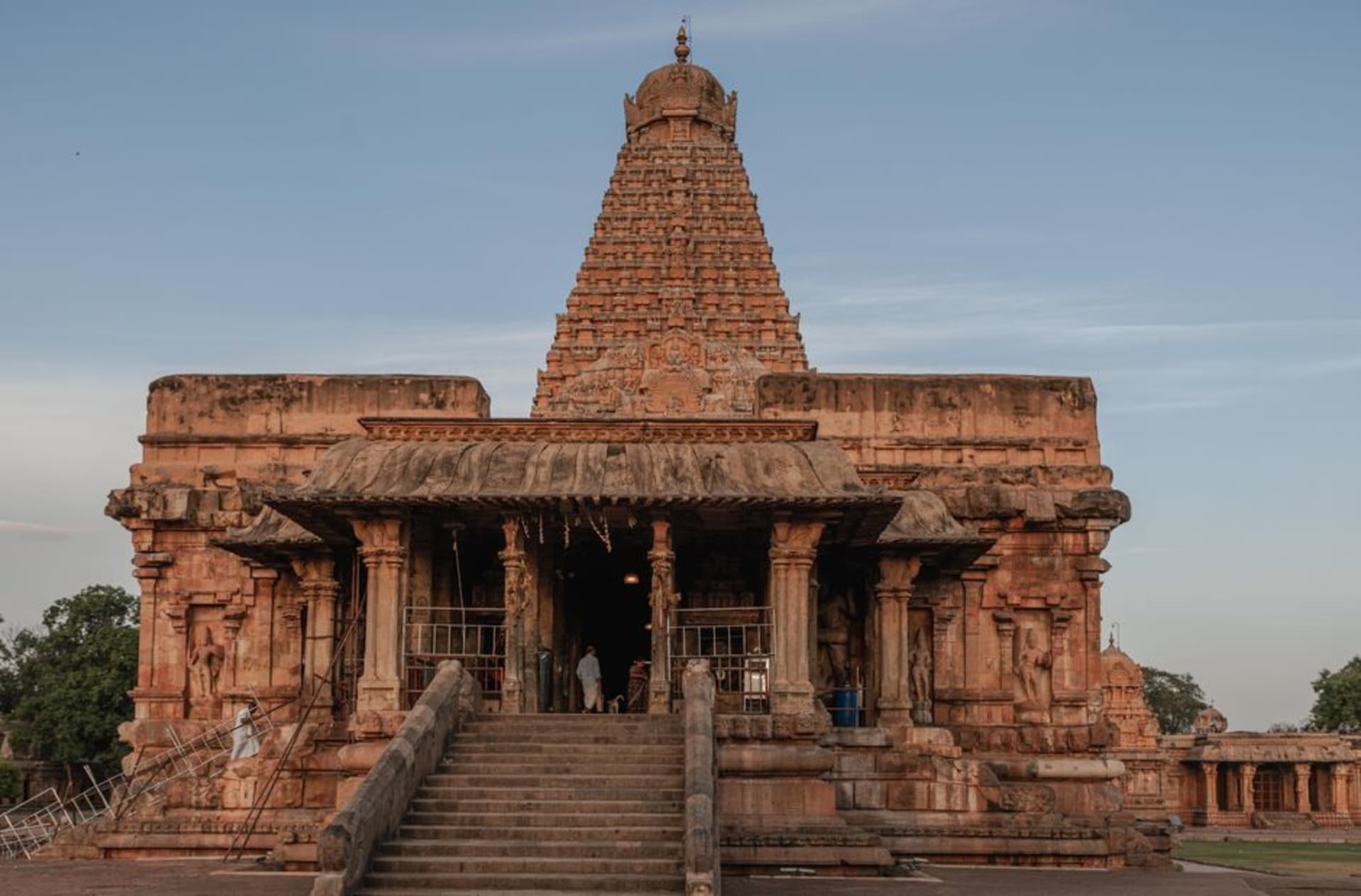 Brihadeeswarar Temple's massive granite vimana tower rising against a clear blue sky in Thanjavur