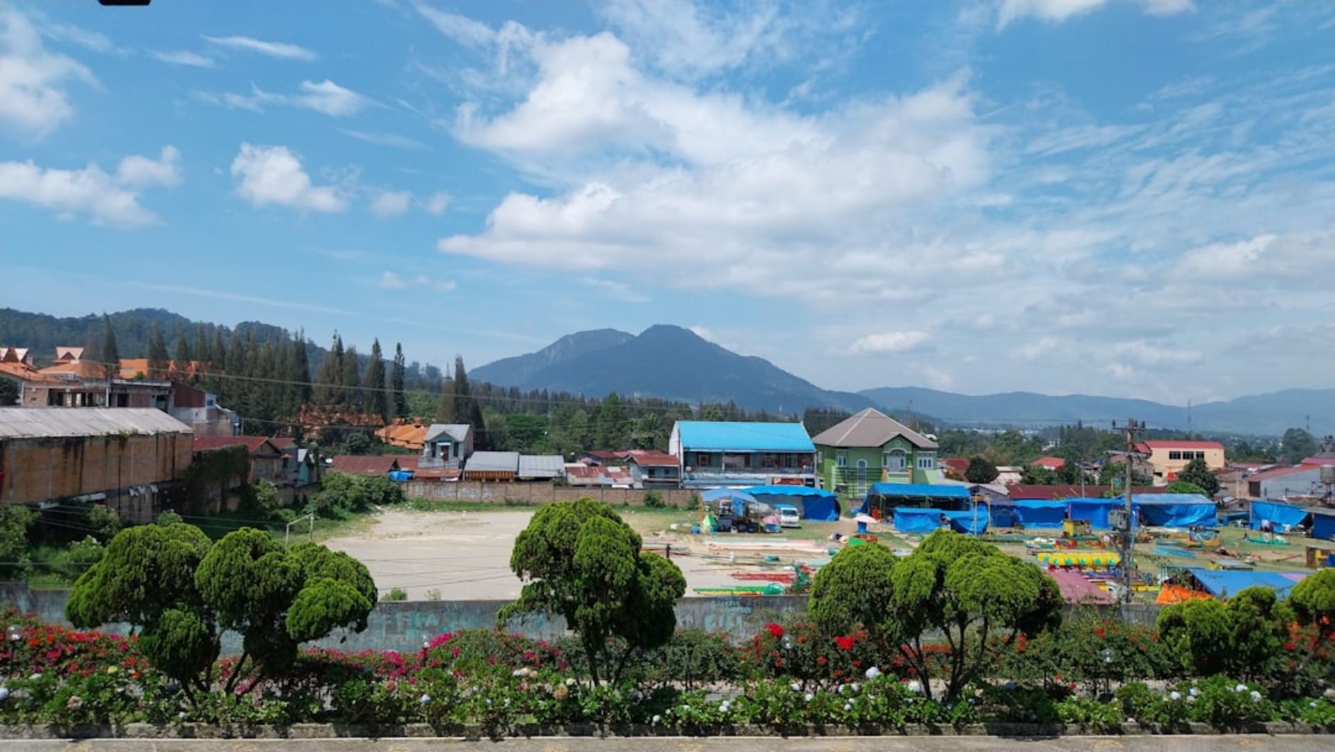 View over Ambon Bay with the hillside city and forested hills in the background