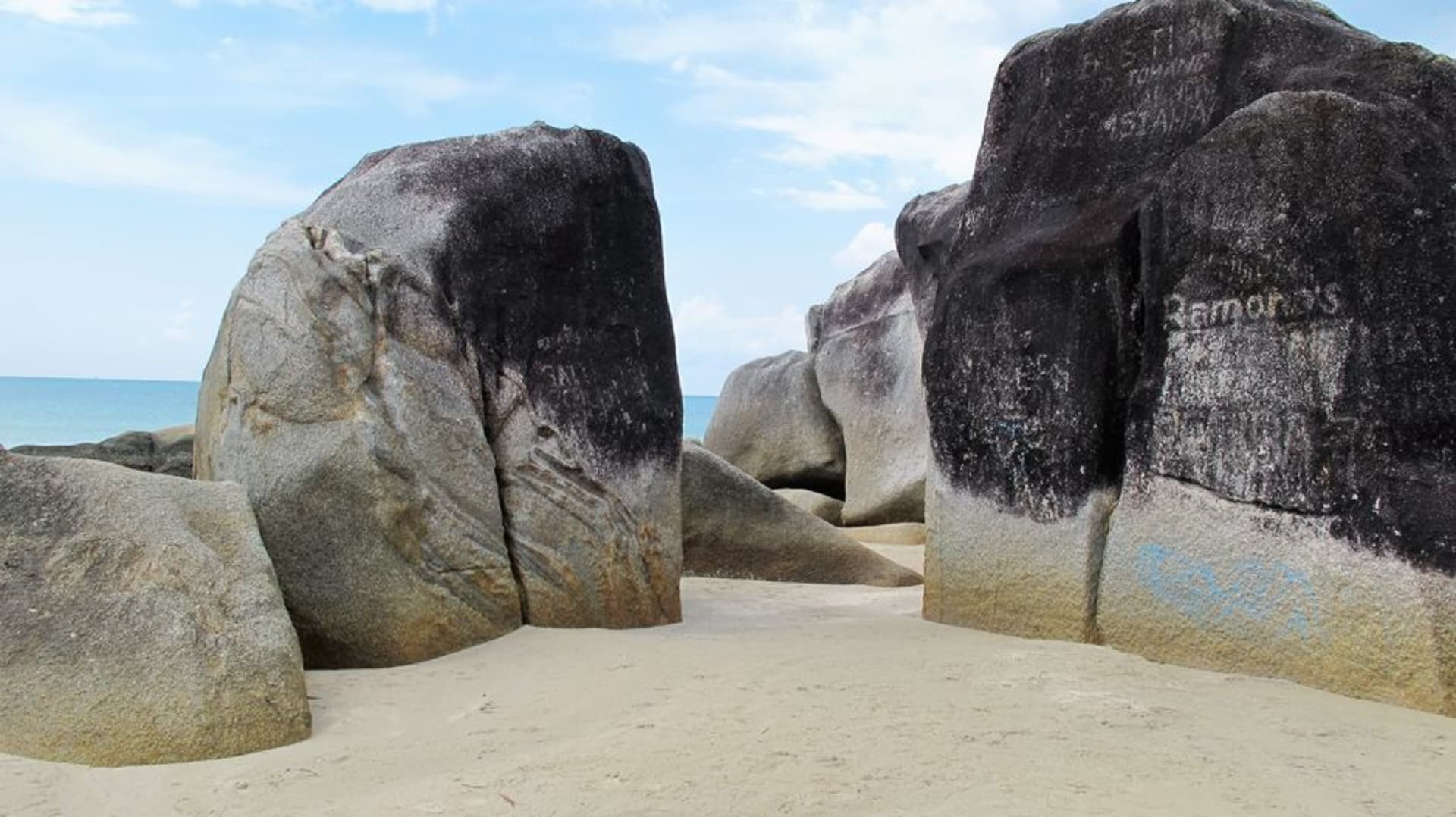 Massive granite boulders on a white sand beach at Tanjung Tinggi, Belitung