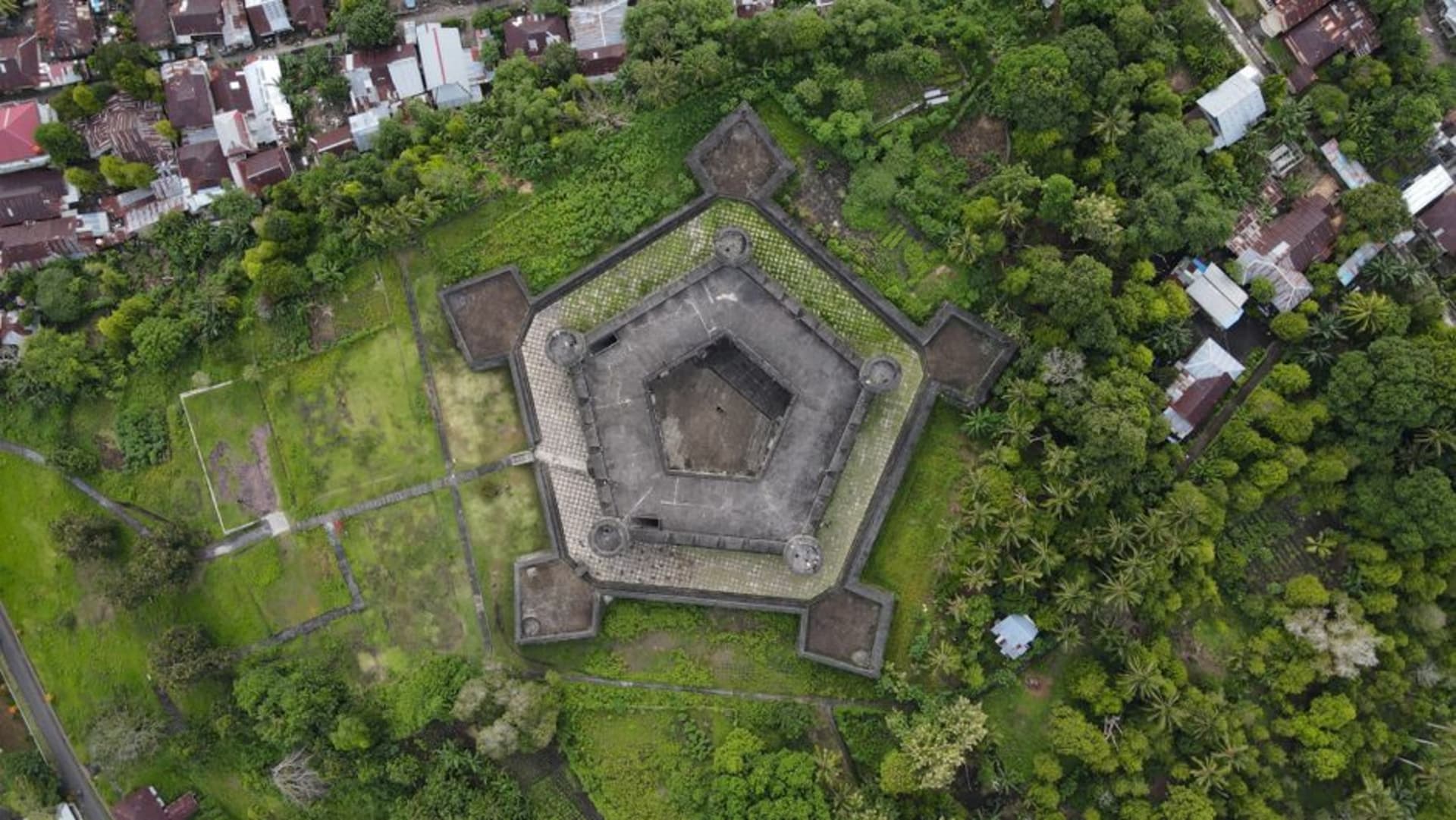Fort Marlborough's brick ramparts overlooking the Indian Ocean coastline at Bengkulu