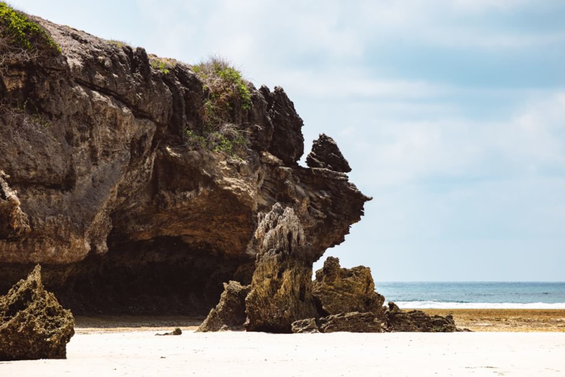 White sand beach and turquoise water at Tanjung Bira with limestone cliffs