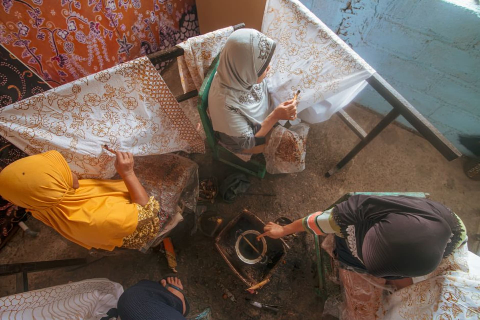 Rows of hand-drawn batik cloth drying in the sun in Pekalongan