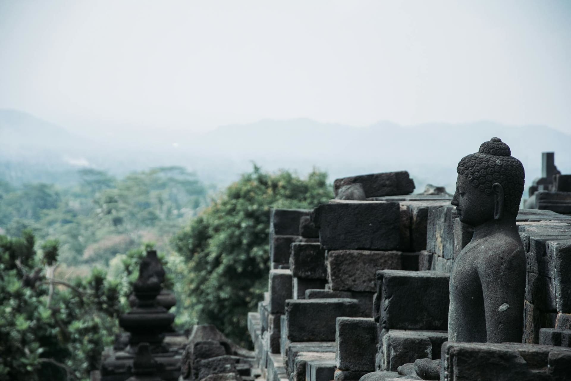 Borobudur temple at dawn with mist rising over the Kedu Plain