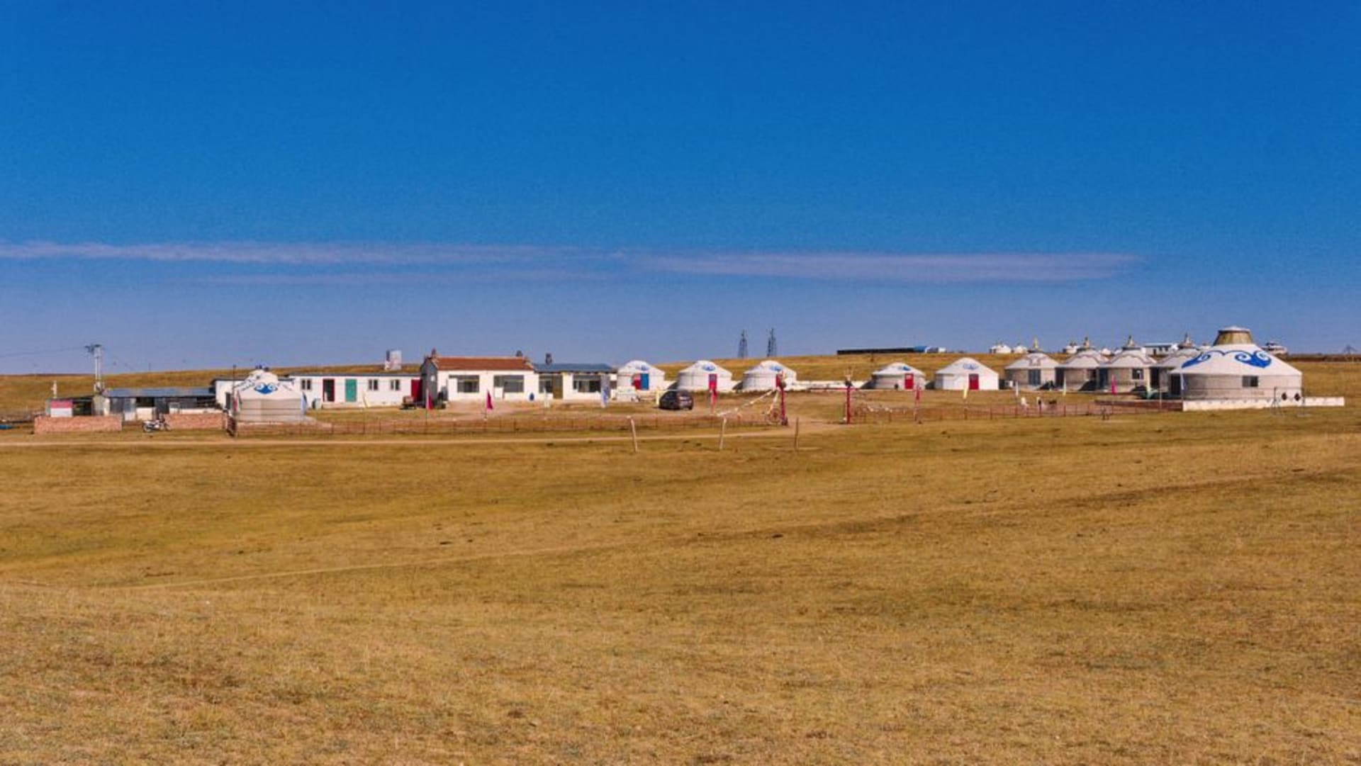 Rolling green steppe of the Xilingol Grassland under a wide open sky near Xilinhot