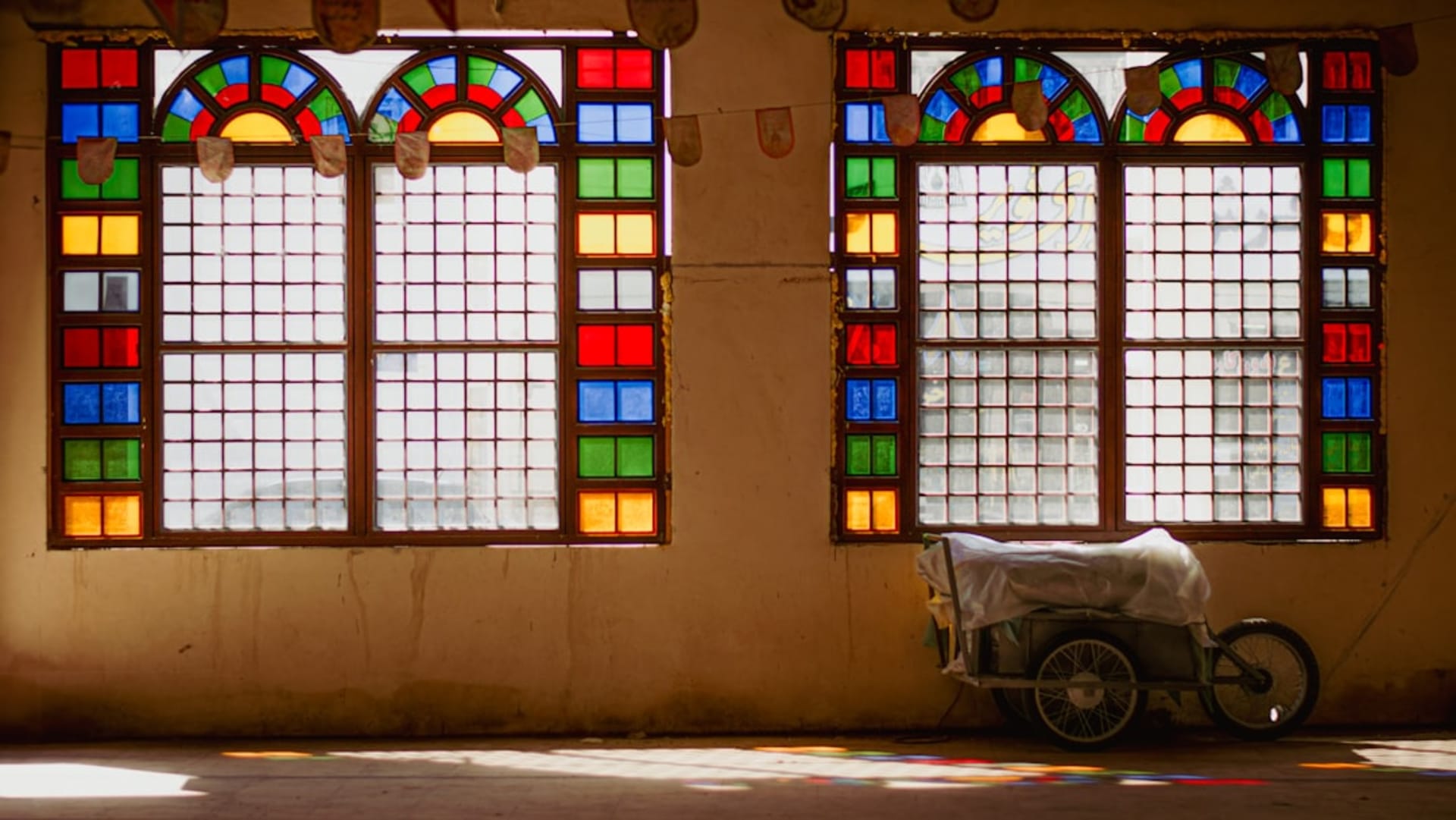 Ornate wooden balconies and coral-stone facades of old colonial-era merchant houses in Bushehr
