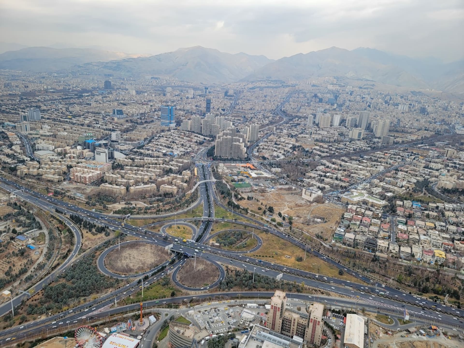 The multi-level timber and steel Tabiat Bridge in Tehran connecting two park hills, photographed at golden hour