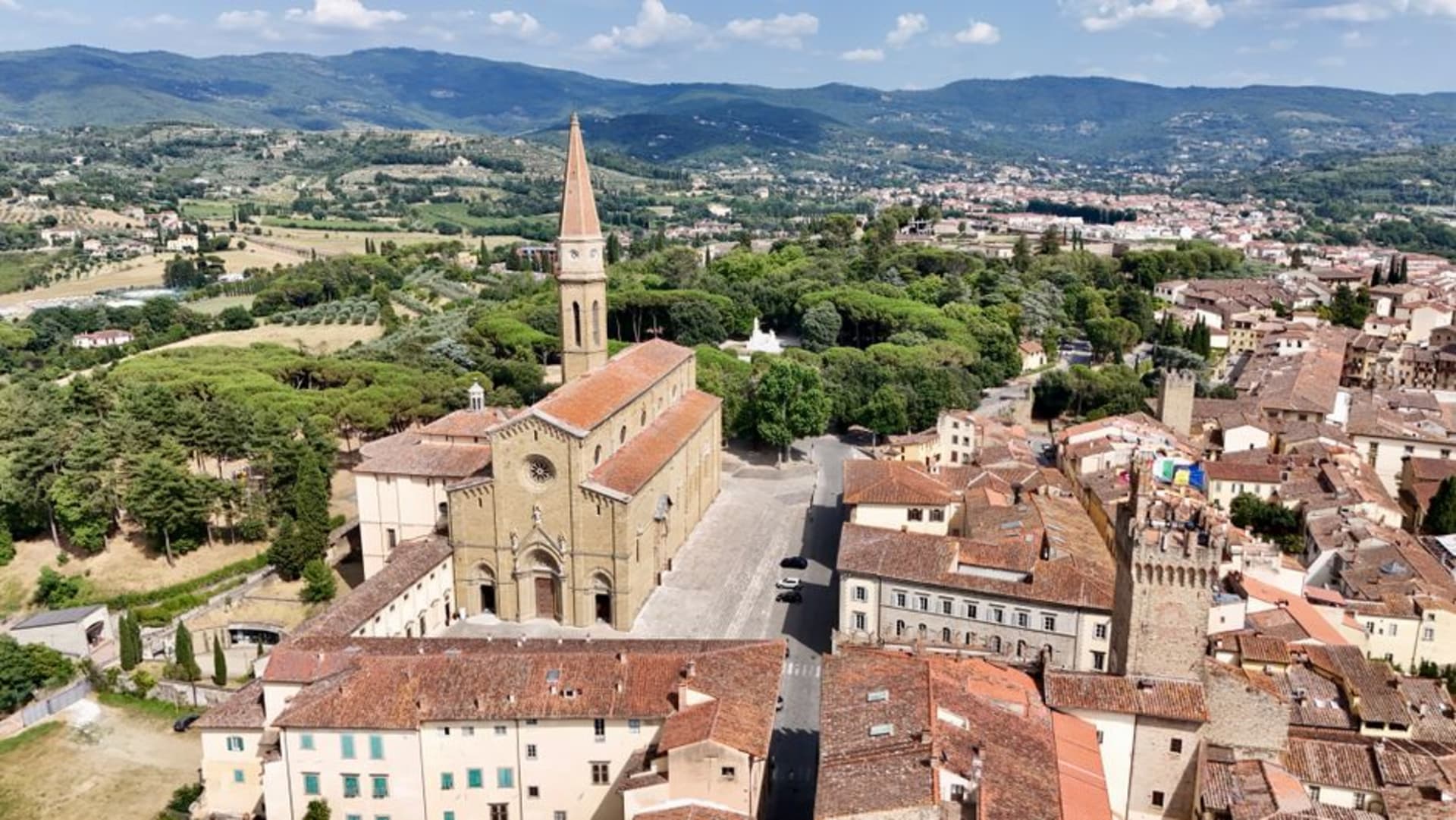 The medieval skyline of Arezzo rising on its hilltop above the surrounding Tuscan valley