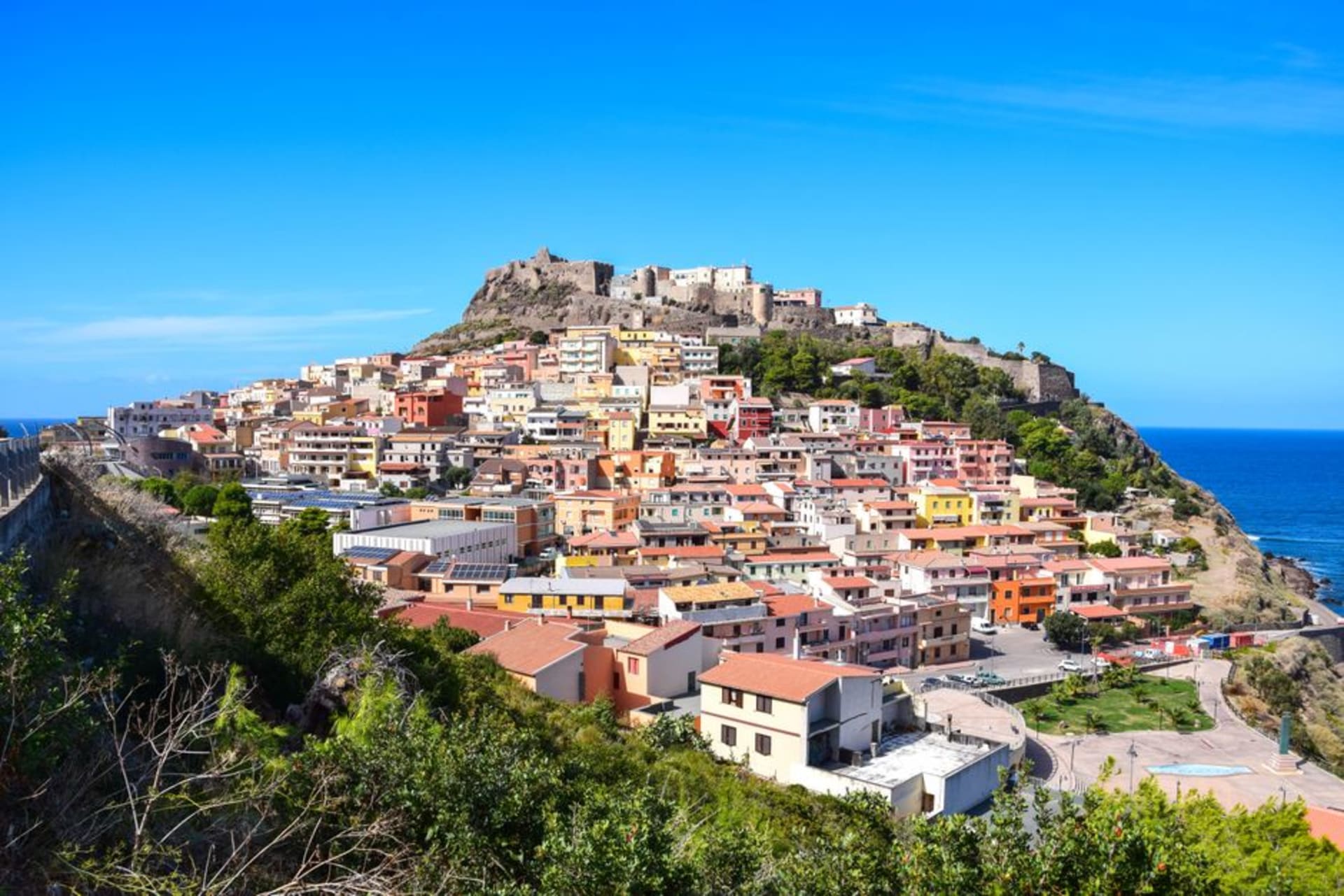 The medieval hilltop town of Castelsardo on Sardinia's northern coast, houses stacked beneath the Doria castle