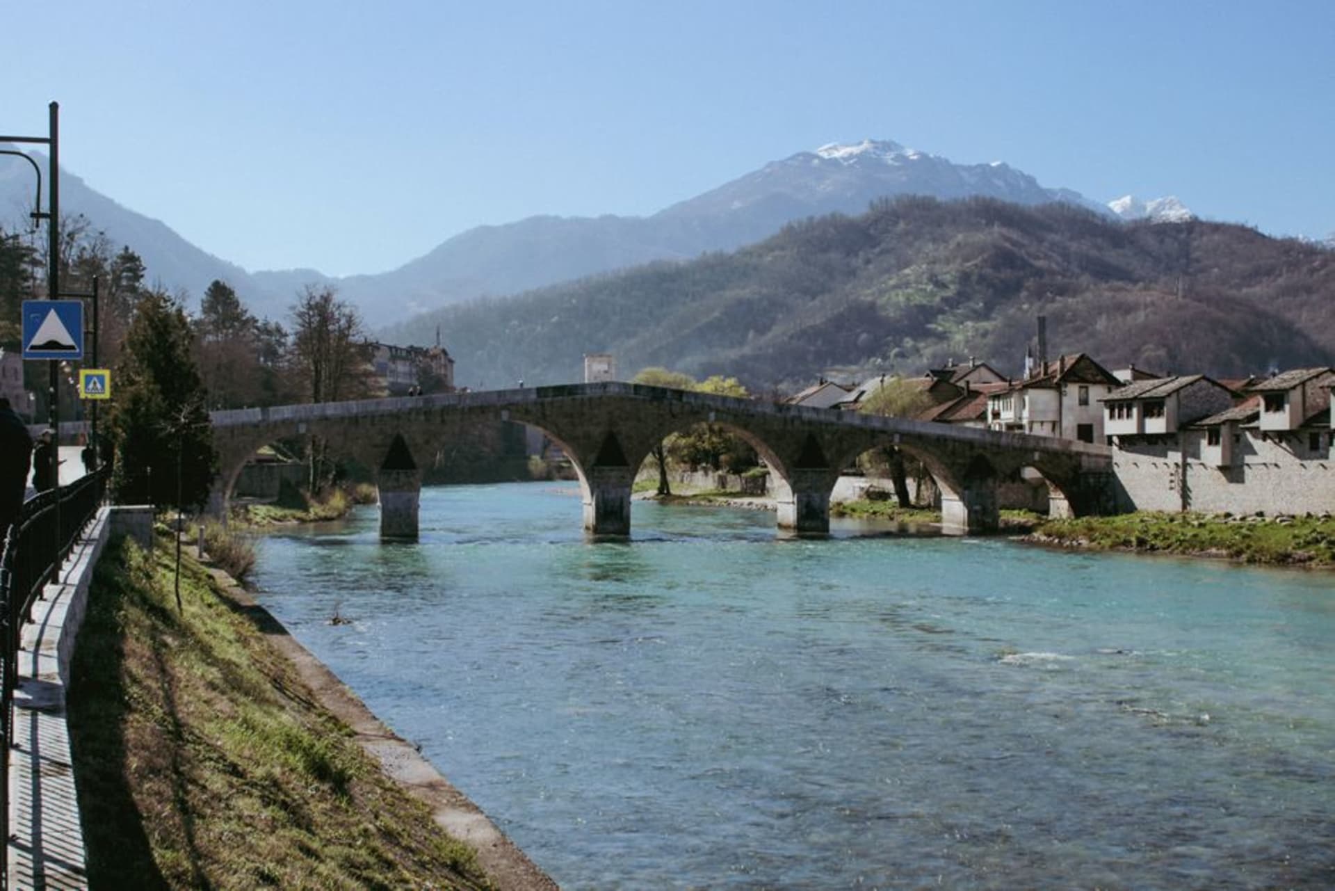 The stone Ponte del Diavolo arching over the turquoise Natisone river in Cividale del Friuli