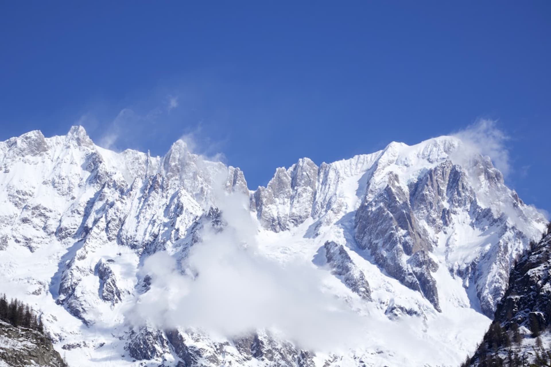 The town of Courmayeur nestled beneath the snow-covered north face of Mont Blanc in Valle d'Aosta