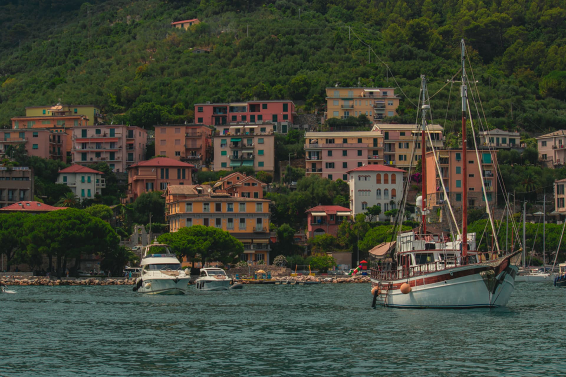 The harbor of La Spezia with naval ships and colorful buildings along the waterfront