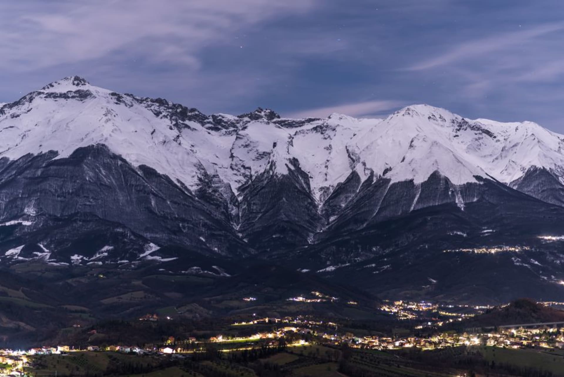 The historic center of L'Aquila with the Gran Sasso massif rising behind the city