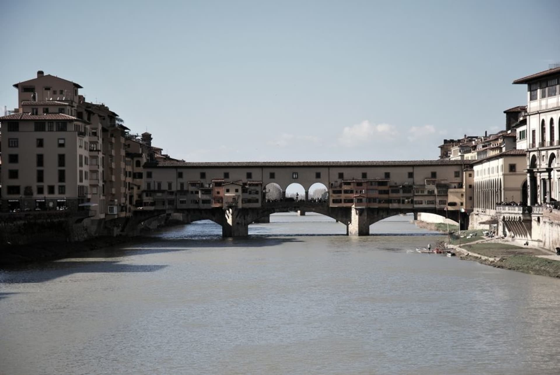 The brick Ponte Coperto covered bridge over the Ticino river in Pavia