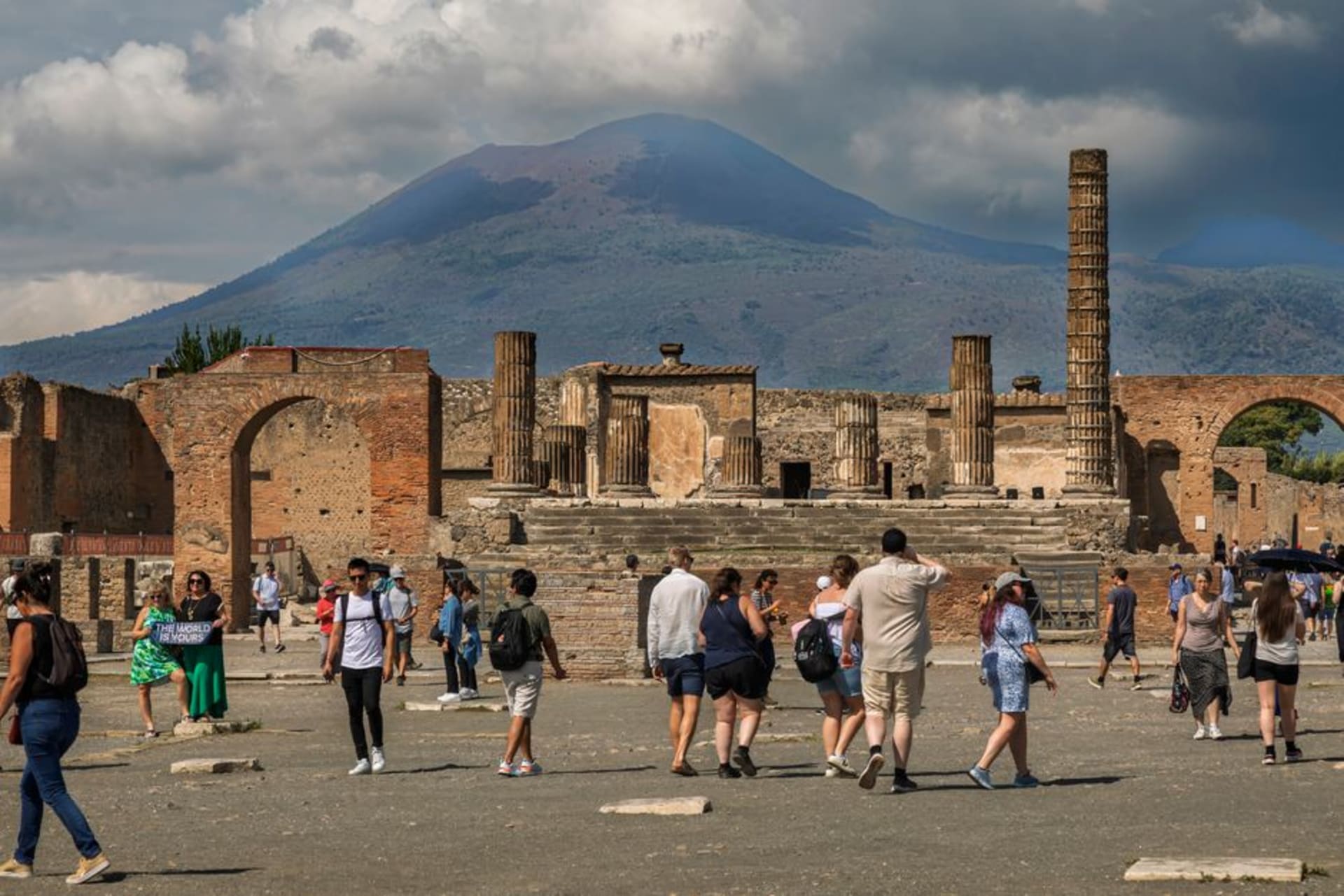 The ruined columns and forum of Pompeii with Mount Vesuvius rising in the background