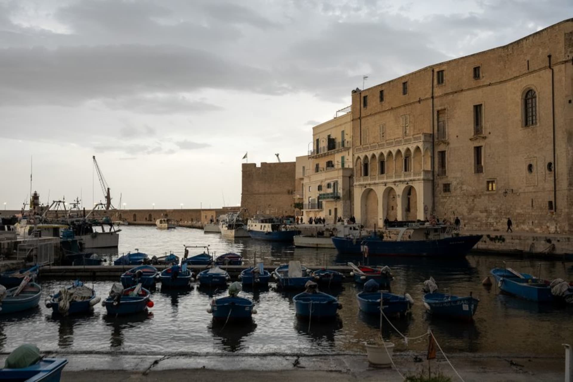 The old port and whitewashed harbor town of Monopoli, Puglia, with fishing boats and the Adriatic Sea