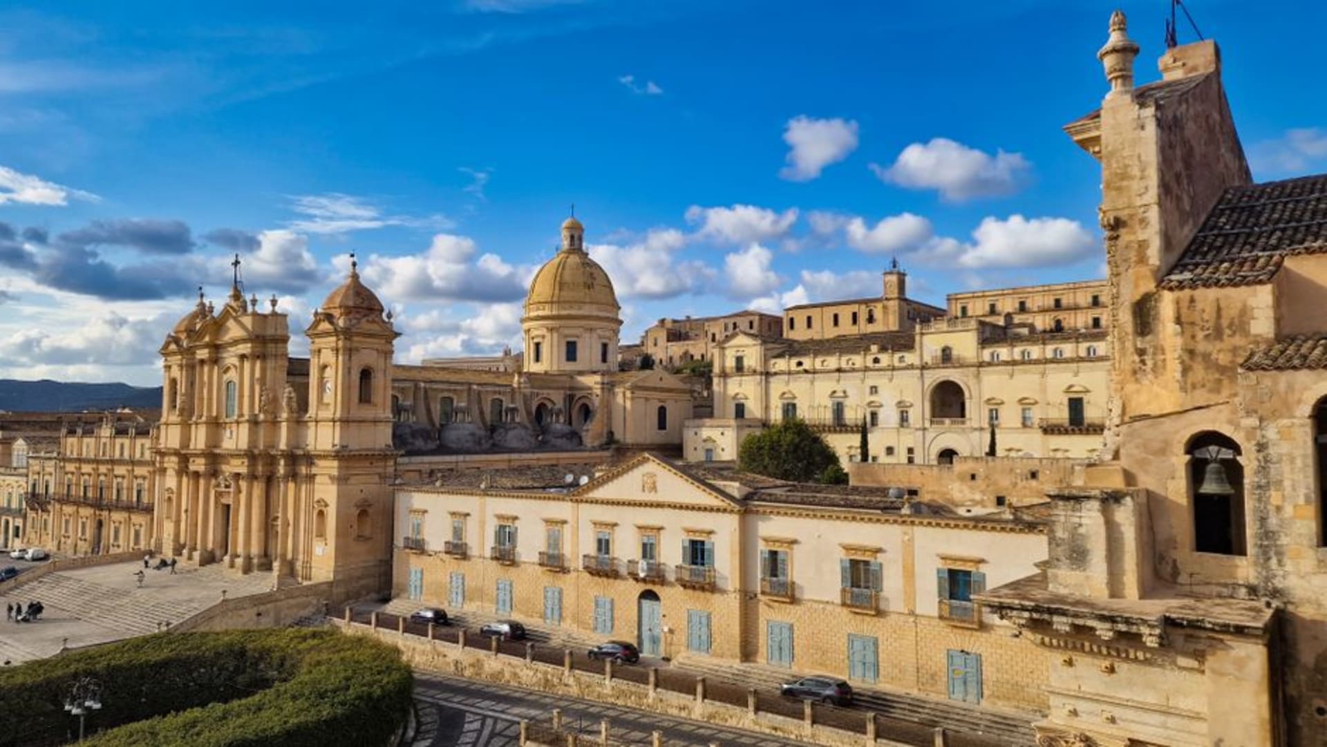 Noto's honey-colored Baroque cathedral and staircase glowing in late afternoon light