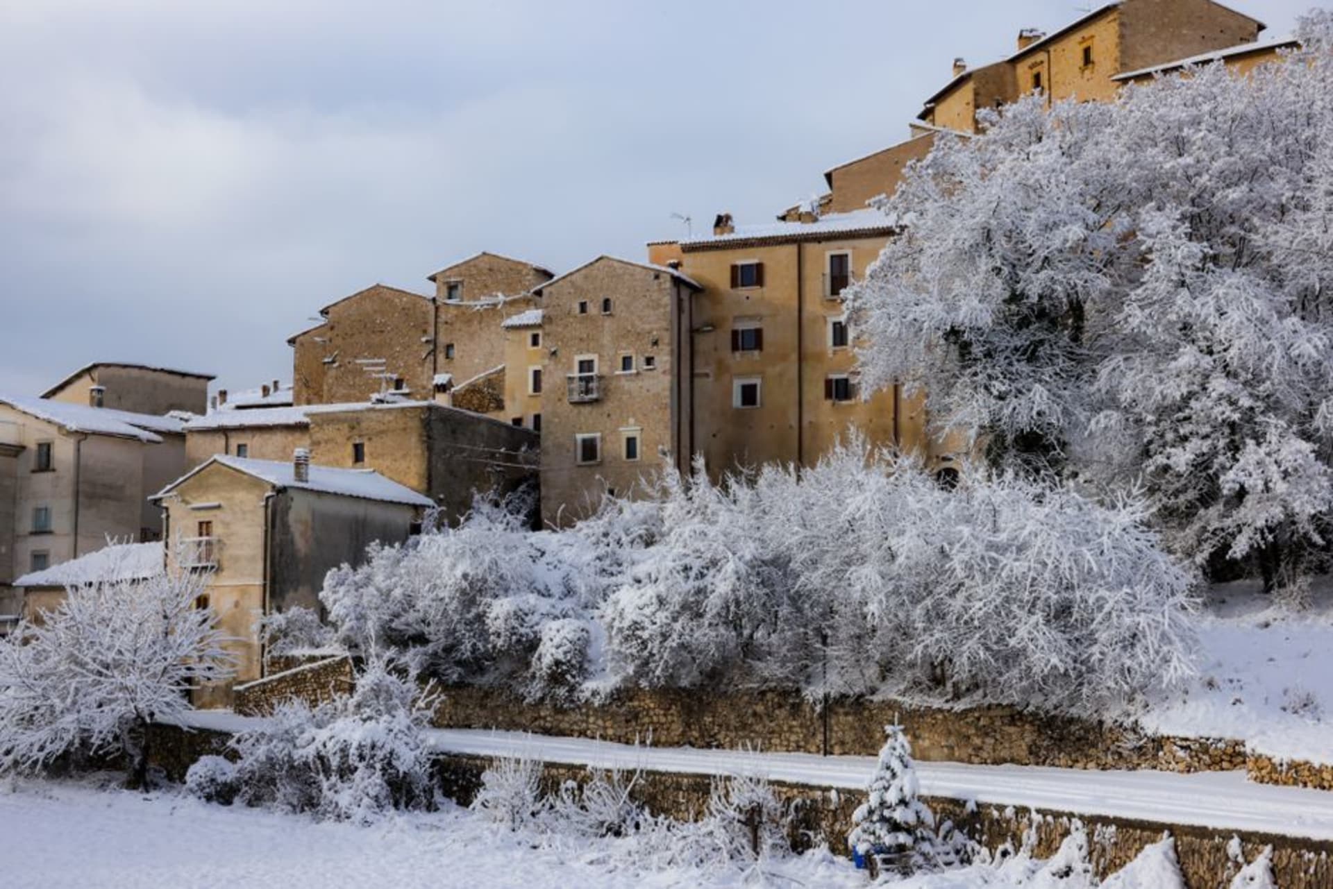Stone houses of Scanno stacked on a steep hillside in the Abruzzo mountains