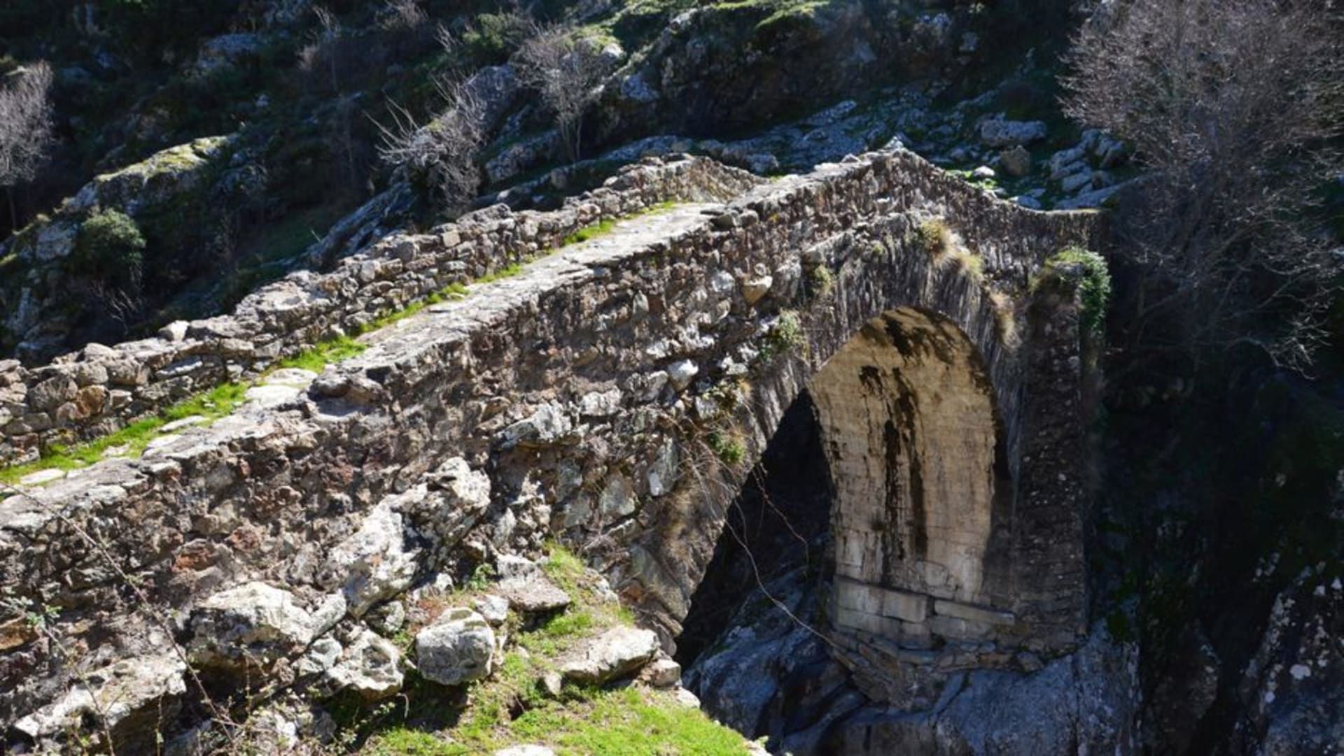 Spoleto's Ponte delle Torri stretching across a deep wooded gorge in Umbria