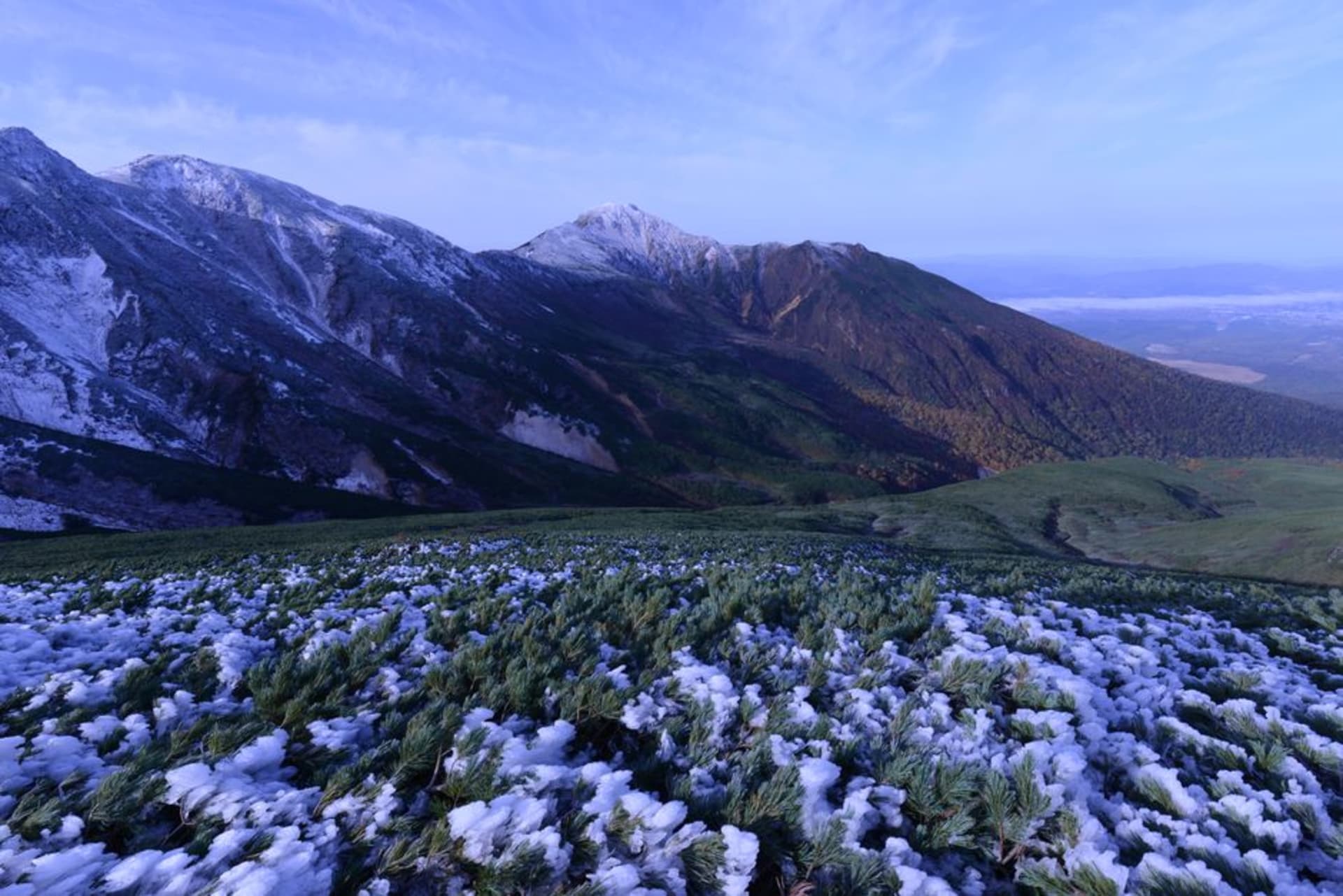 The volcanic summit of Asahidake with steam vents and autumn foliage in Daisetsuzan National Park