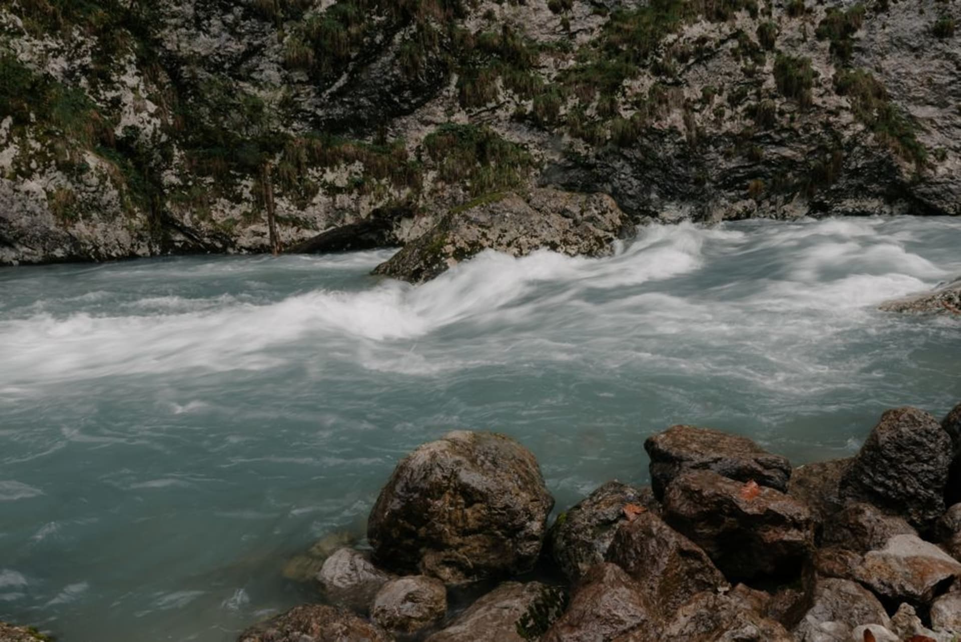 Churning white rapids and jade pools of the Iwai River cutting through jagged rock at Genbikei Gorge