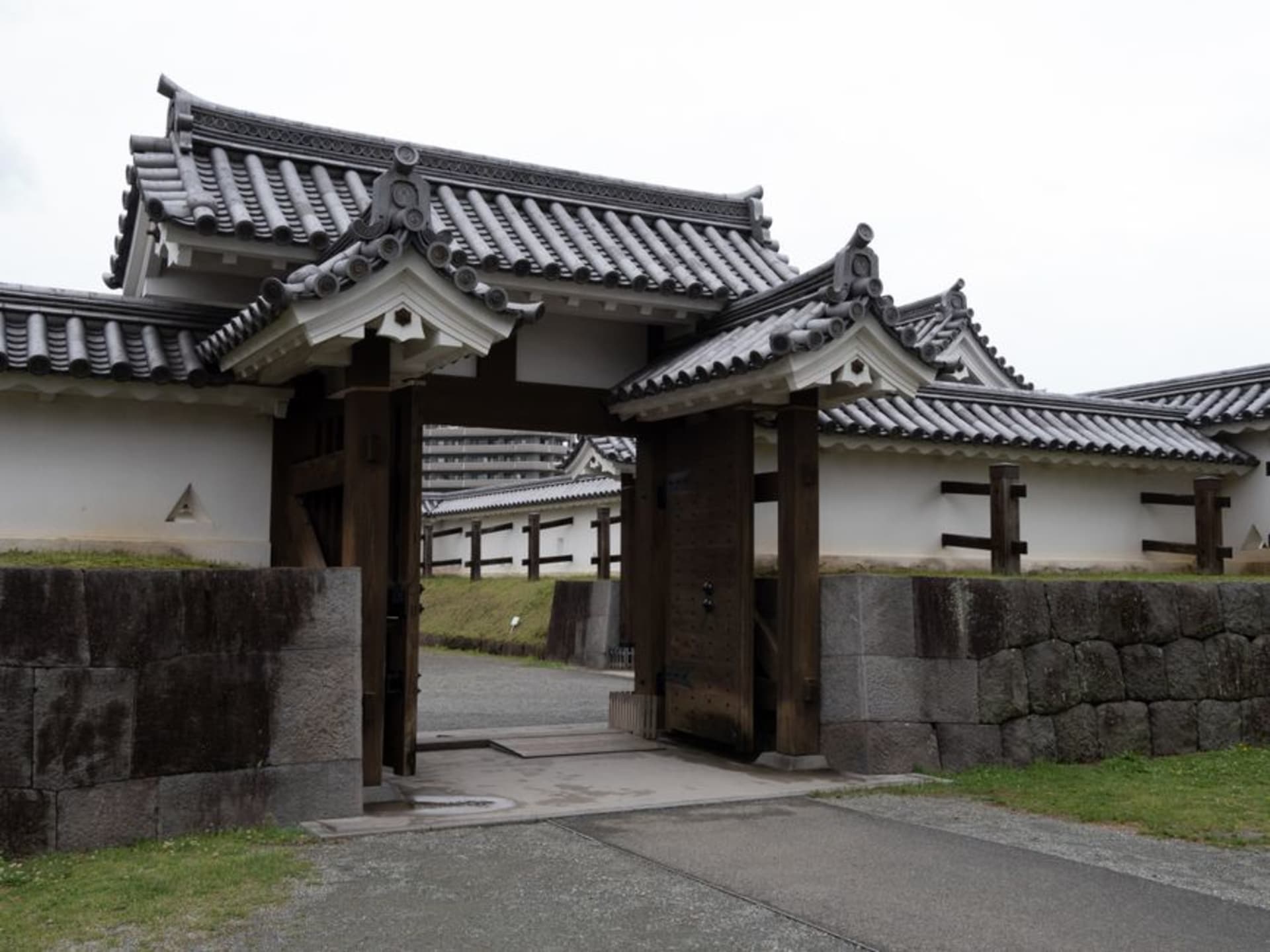 White-walled samurai residences along a quiet earthen street in old Hagi